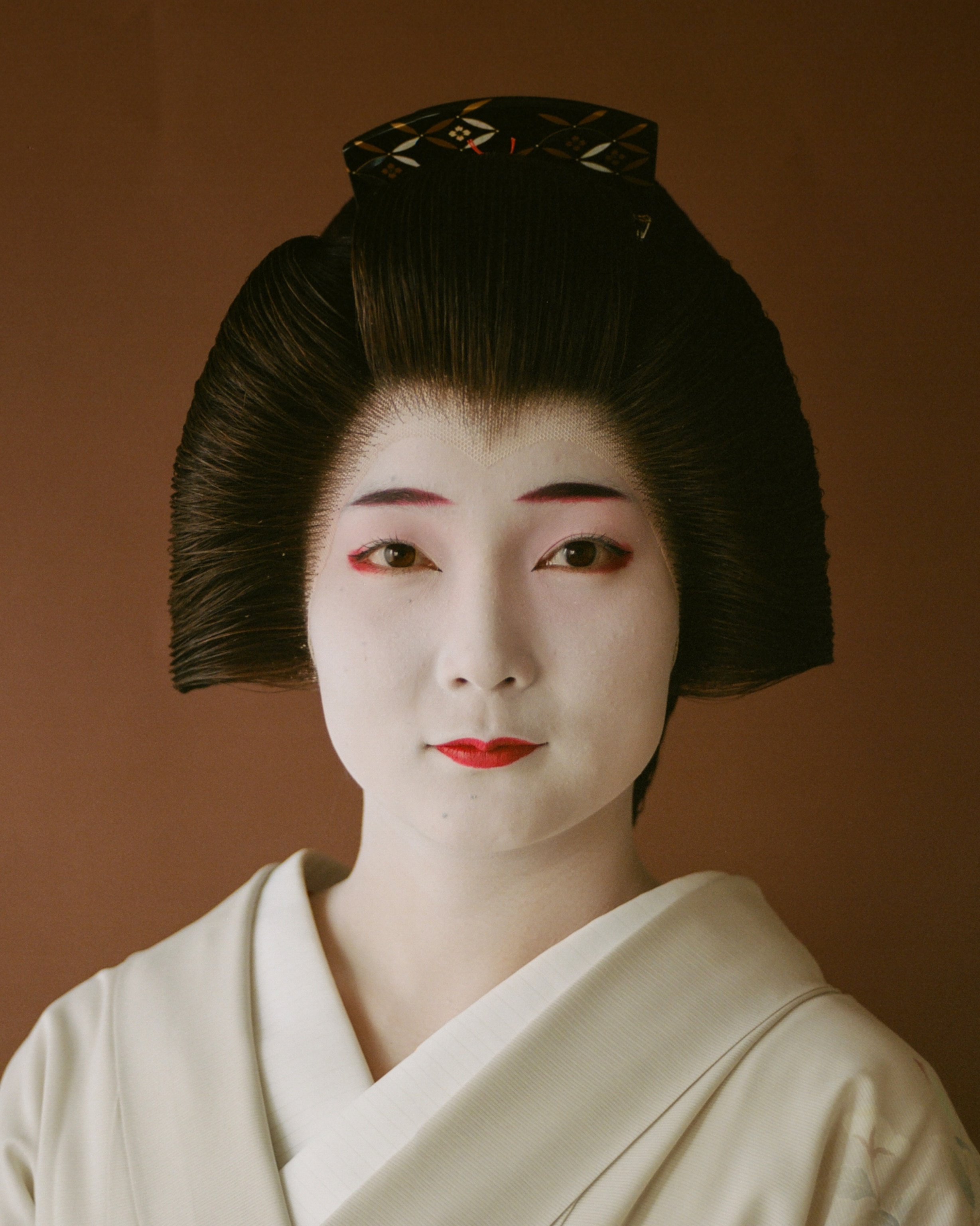 Shichiha in complete geisha makeup.
