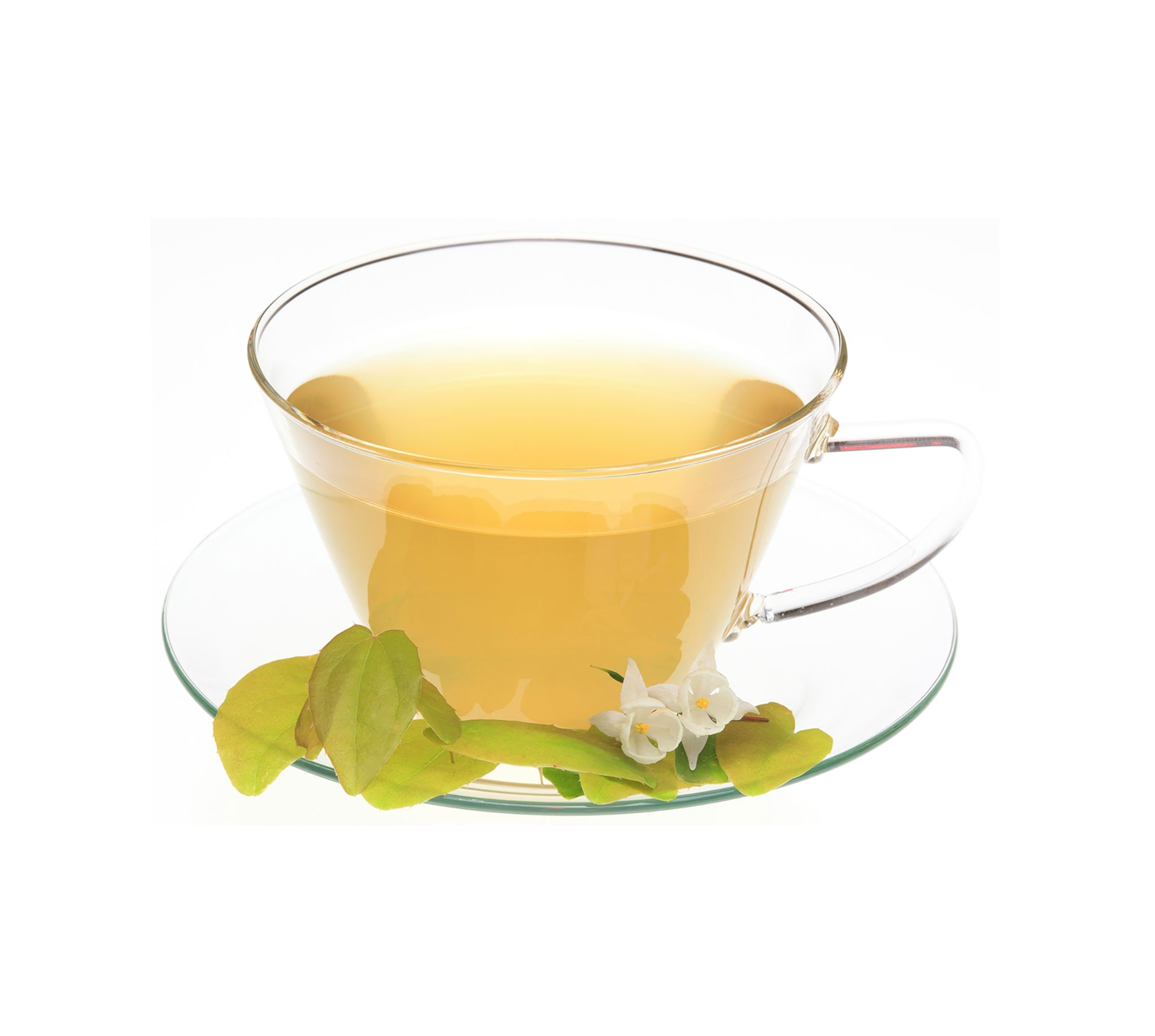 A clear, glass tea cup, with a honey colored liquid, with green leaves and white flowers resting on the tea cup saucer in front of the tea cup.