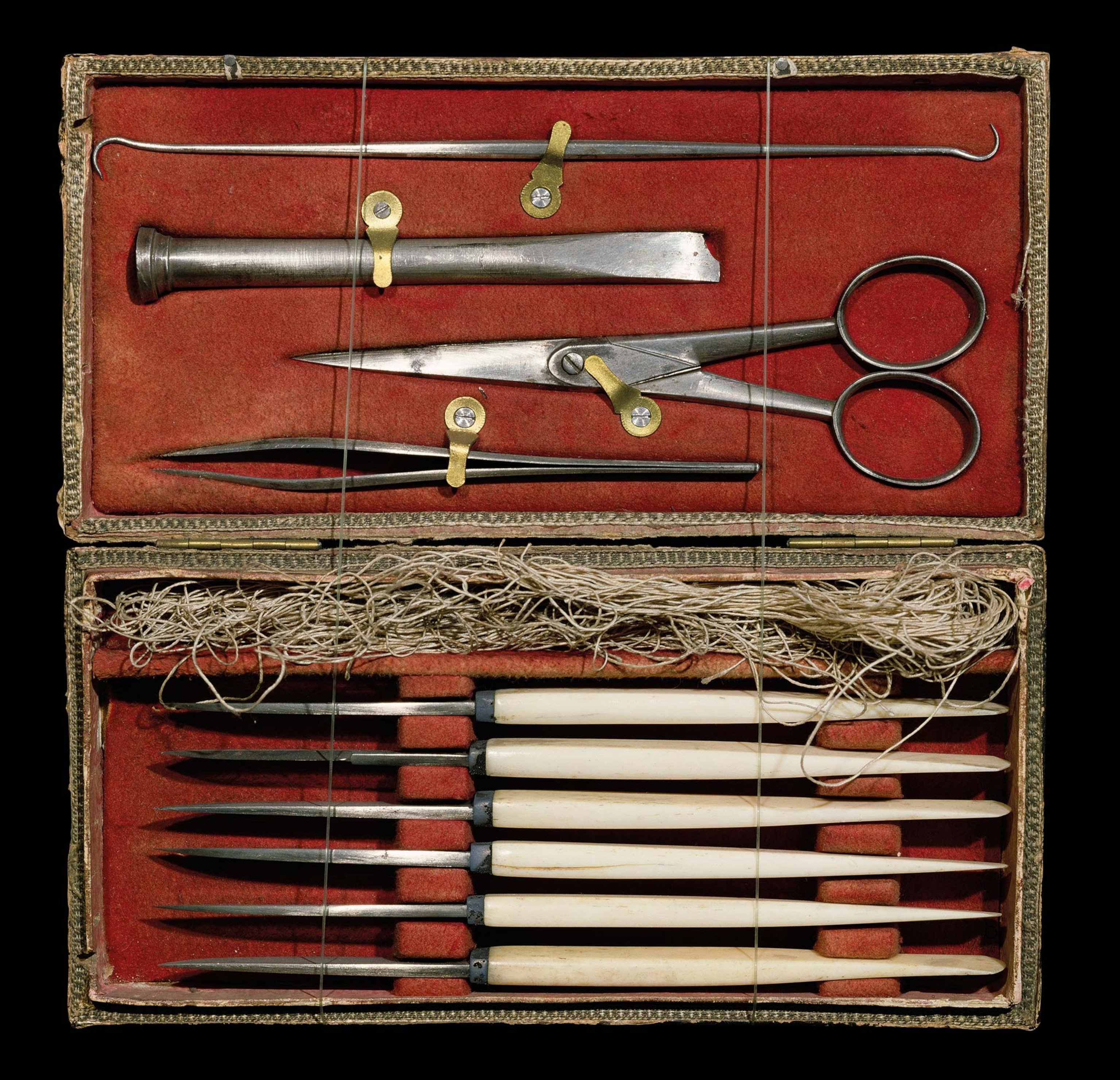 Early 19th century surgical instruments in a red box