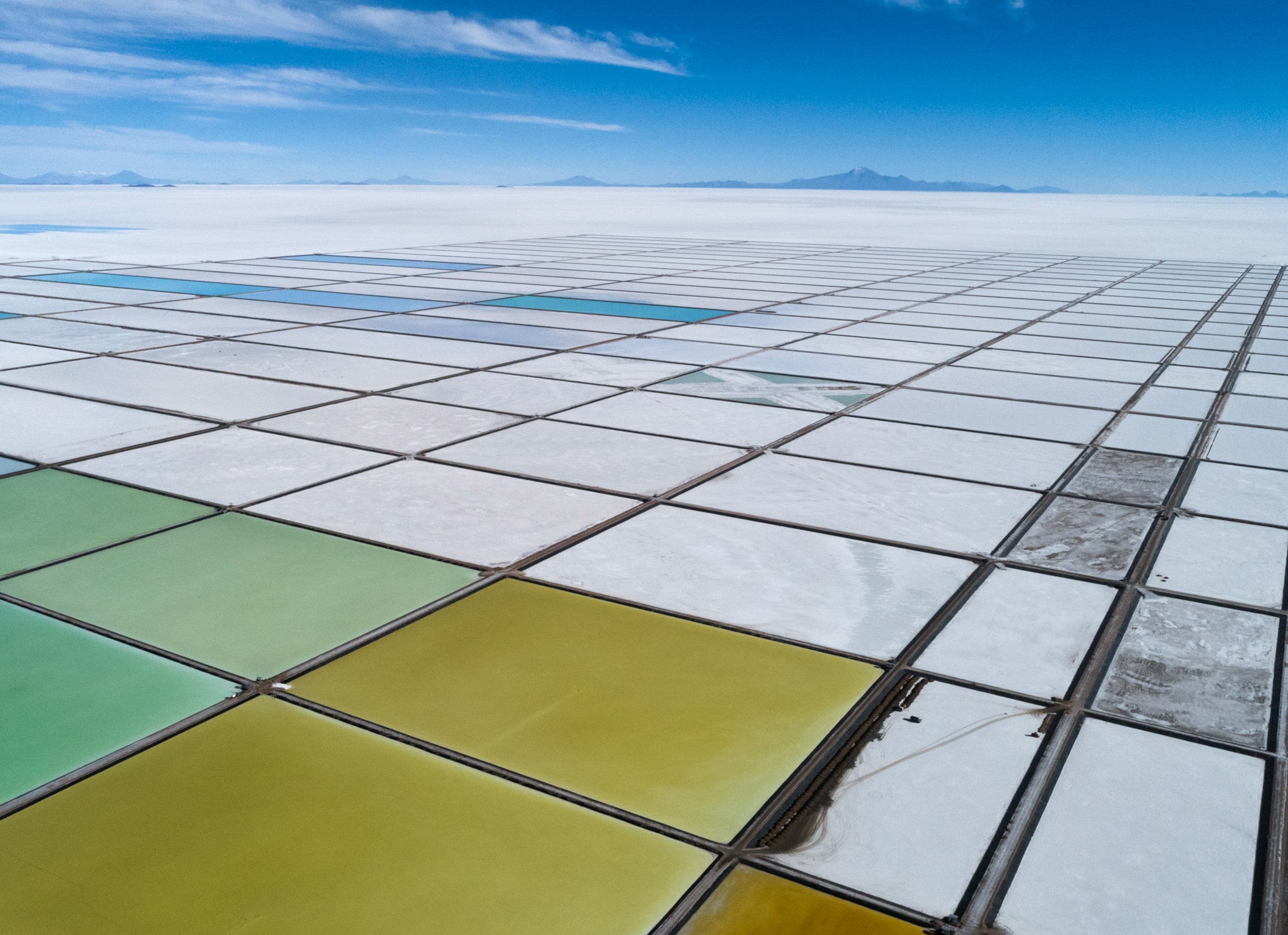 Evaporation pools carved out of the Salar de Uyuni create a colorful mosaic at the Llipi lithium pilot plant.