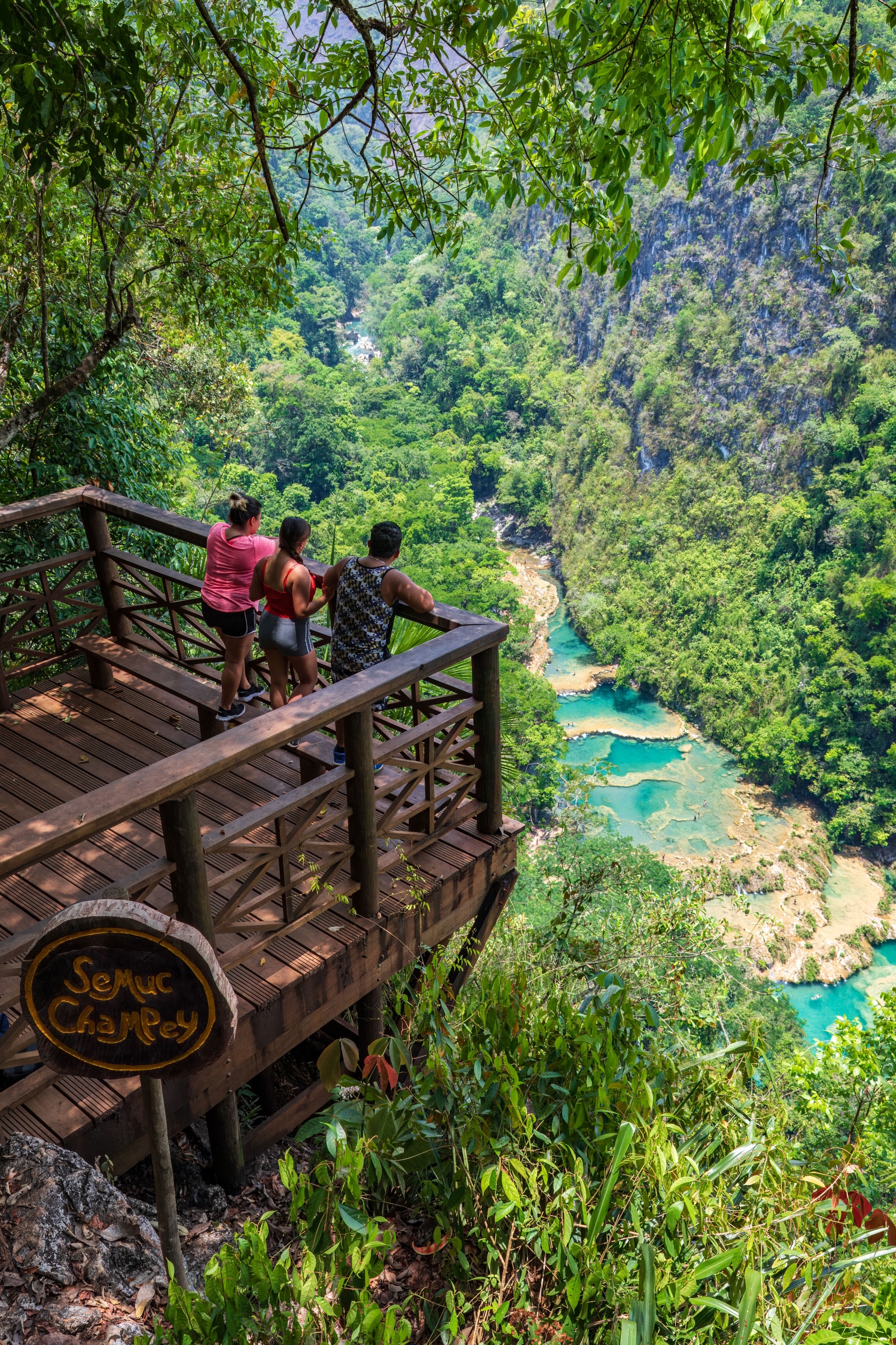 A viewpoint over the natural pools of Semuc Champey, which flow into each other in a series of gentle waterfalls.