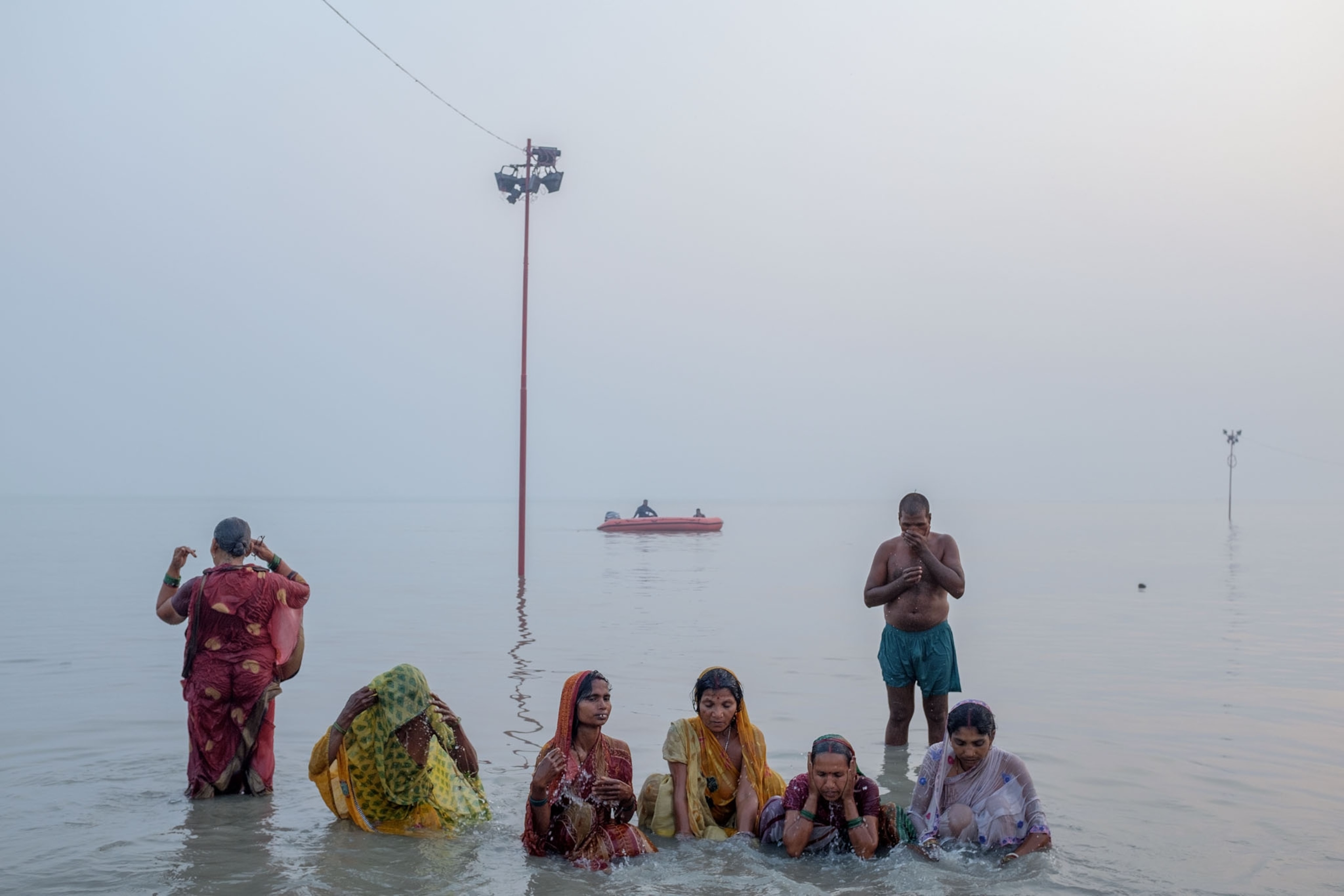 people bathing in water