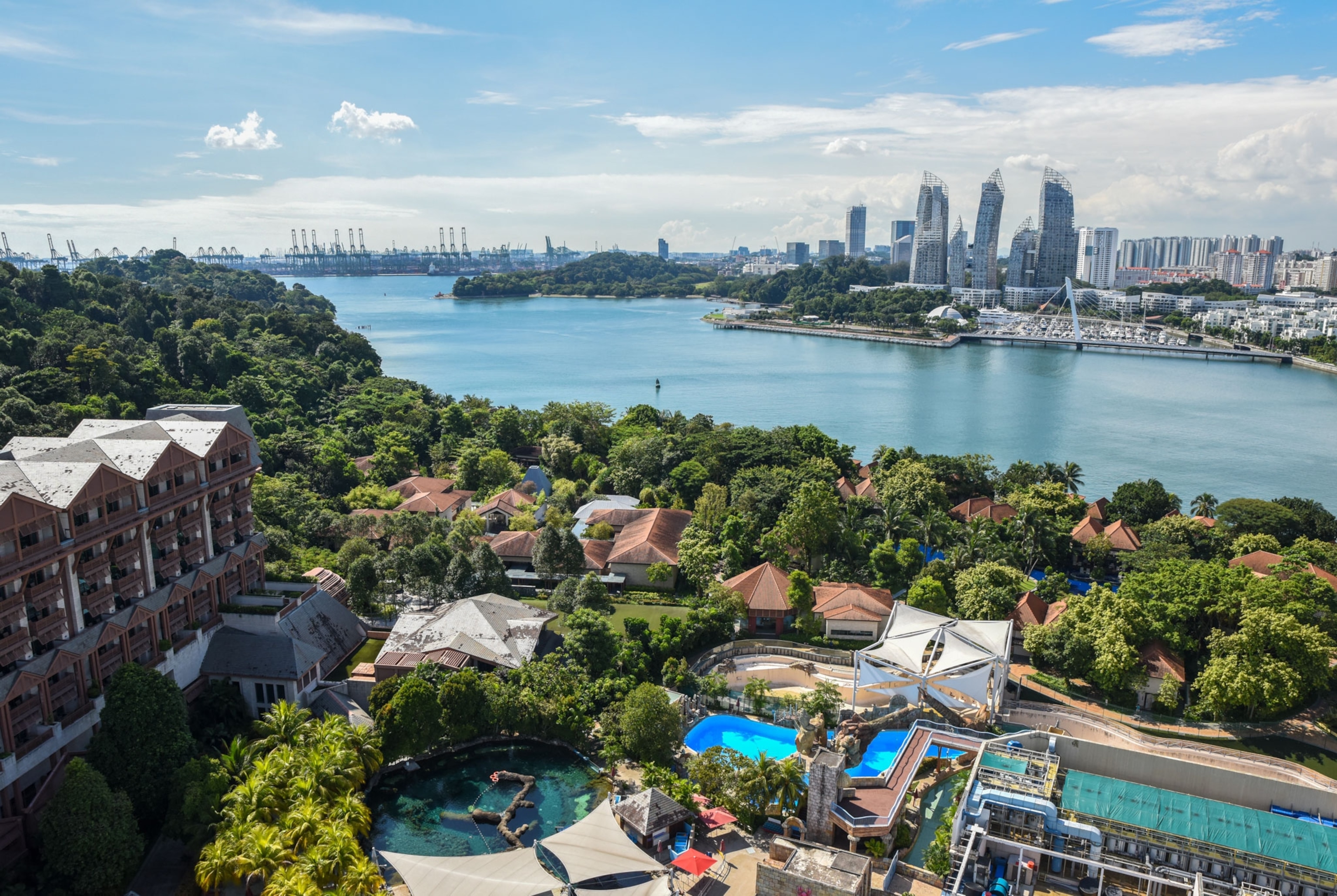 a scenic landscape of a resort and the city separated by water in Singapore