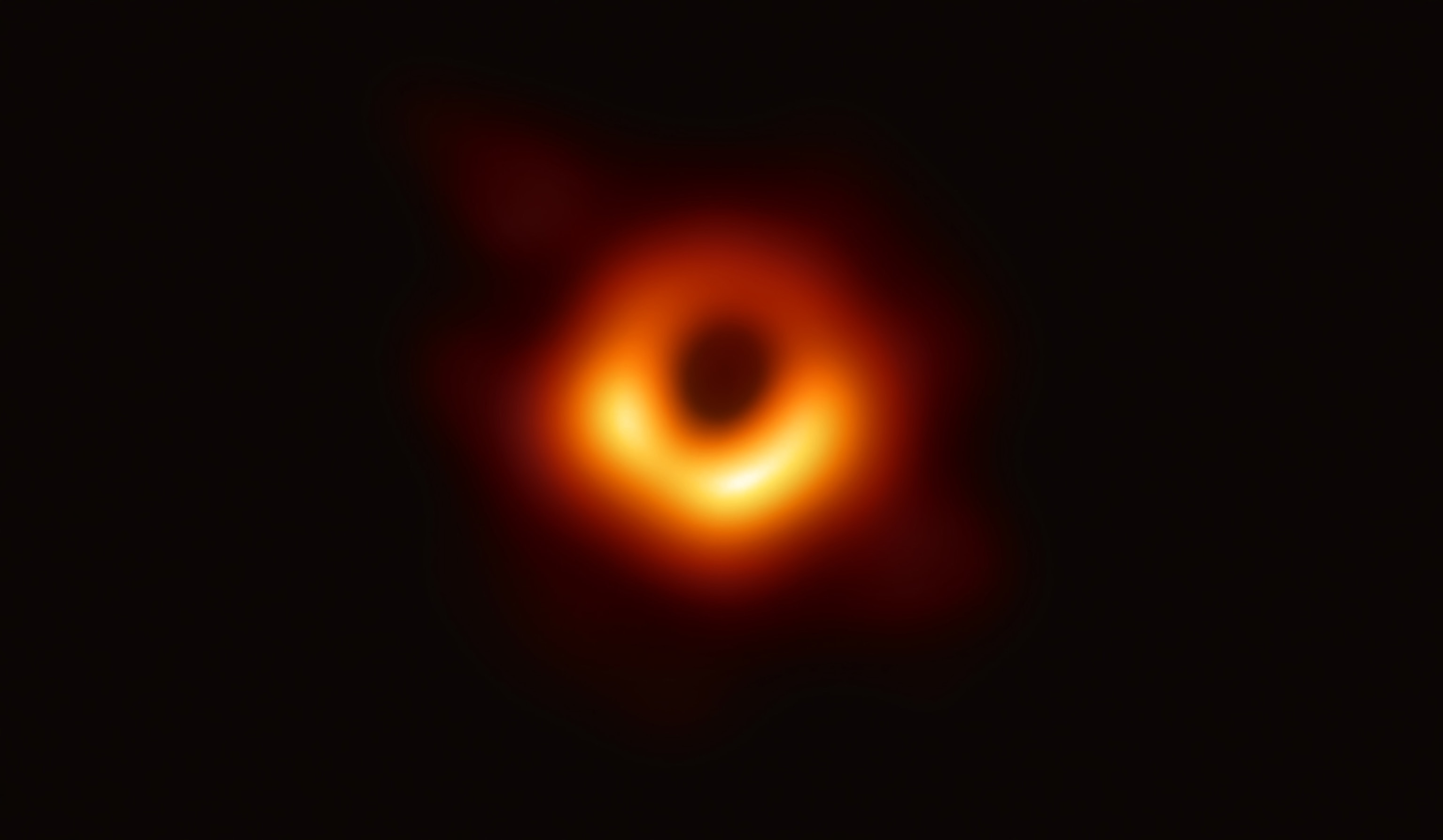 a supermassive black hole and its shadow.