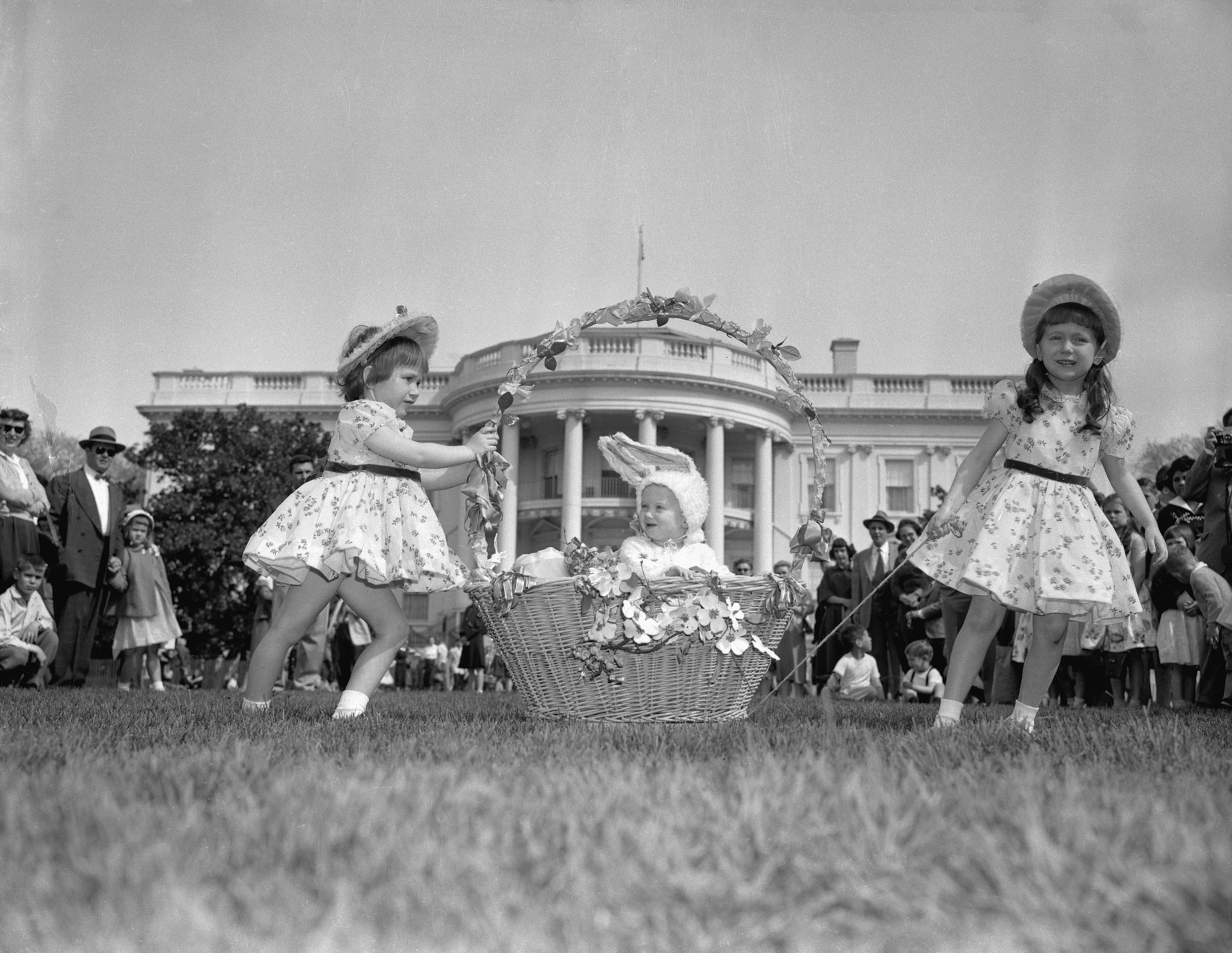girls in Easter dresses in front of White House
