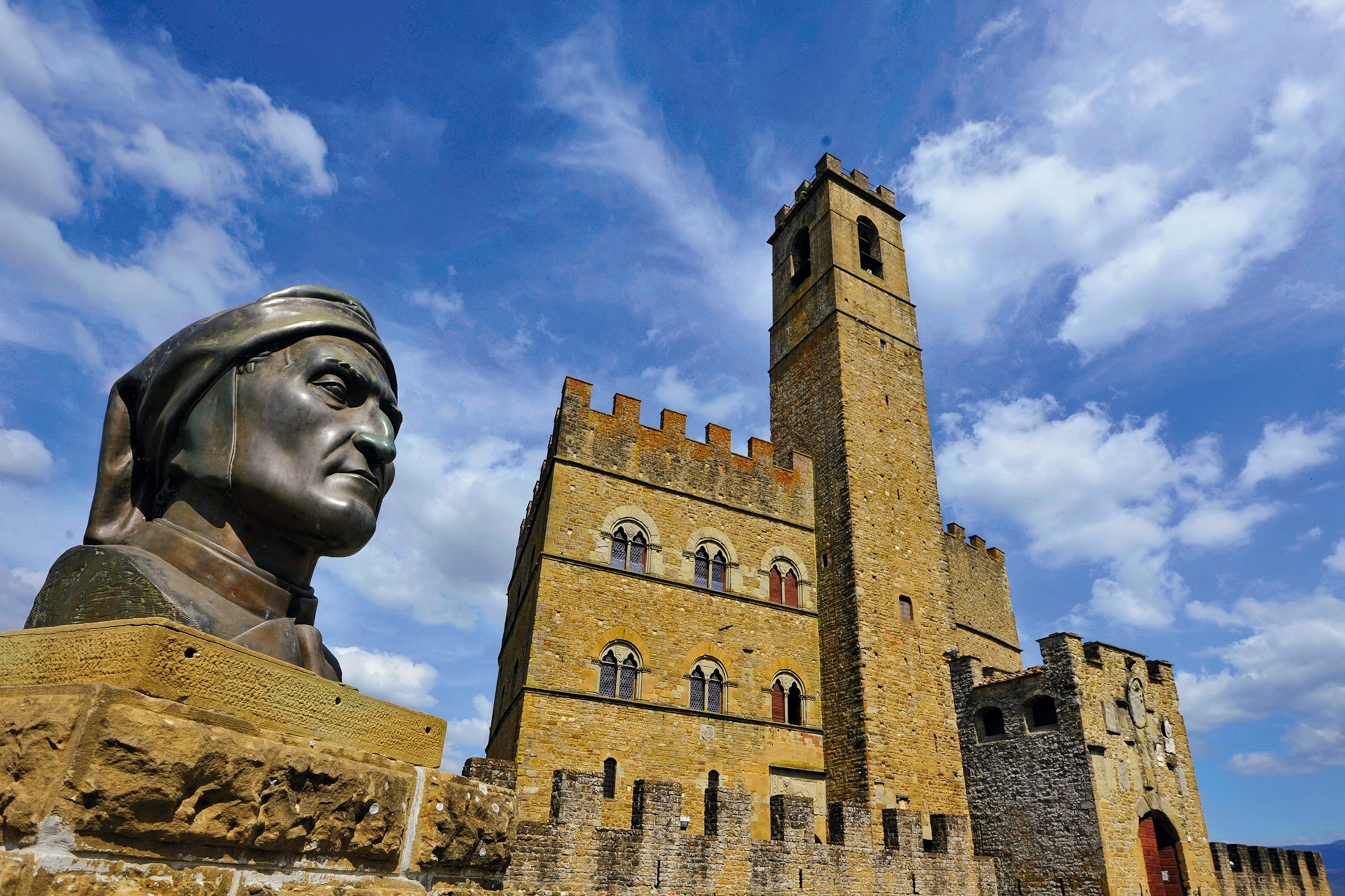 A bust of Dante sits under the 12th-century walls of the Poppi Castle, which overlooks the plains of Campaldino, where Dante fought with the Guelphs in 1289.