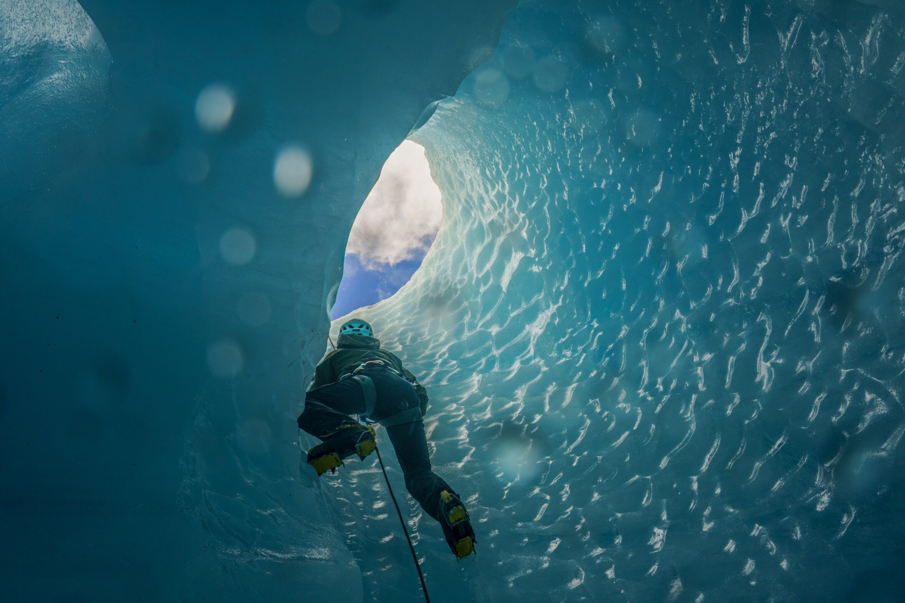 high mountain ranger and military mountaineering instructor climbs an ice cave on the Explorers Glacier