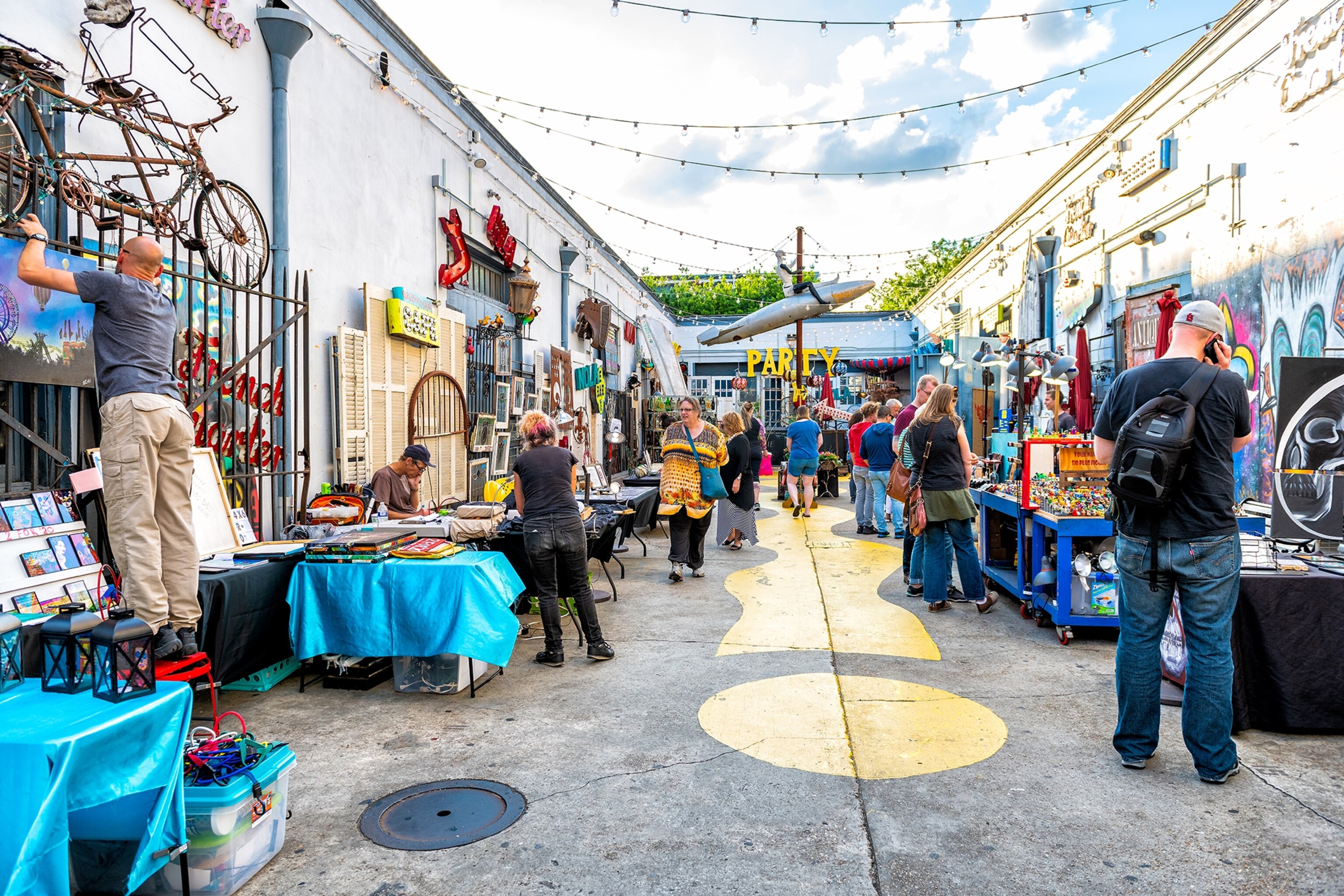 shoppers looking around an outdoor market