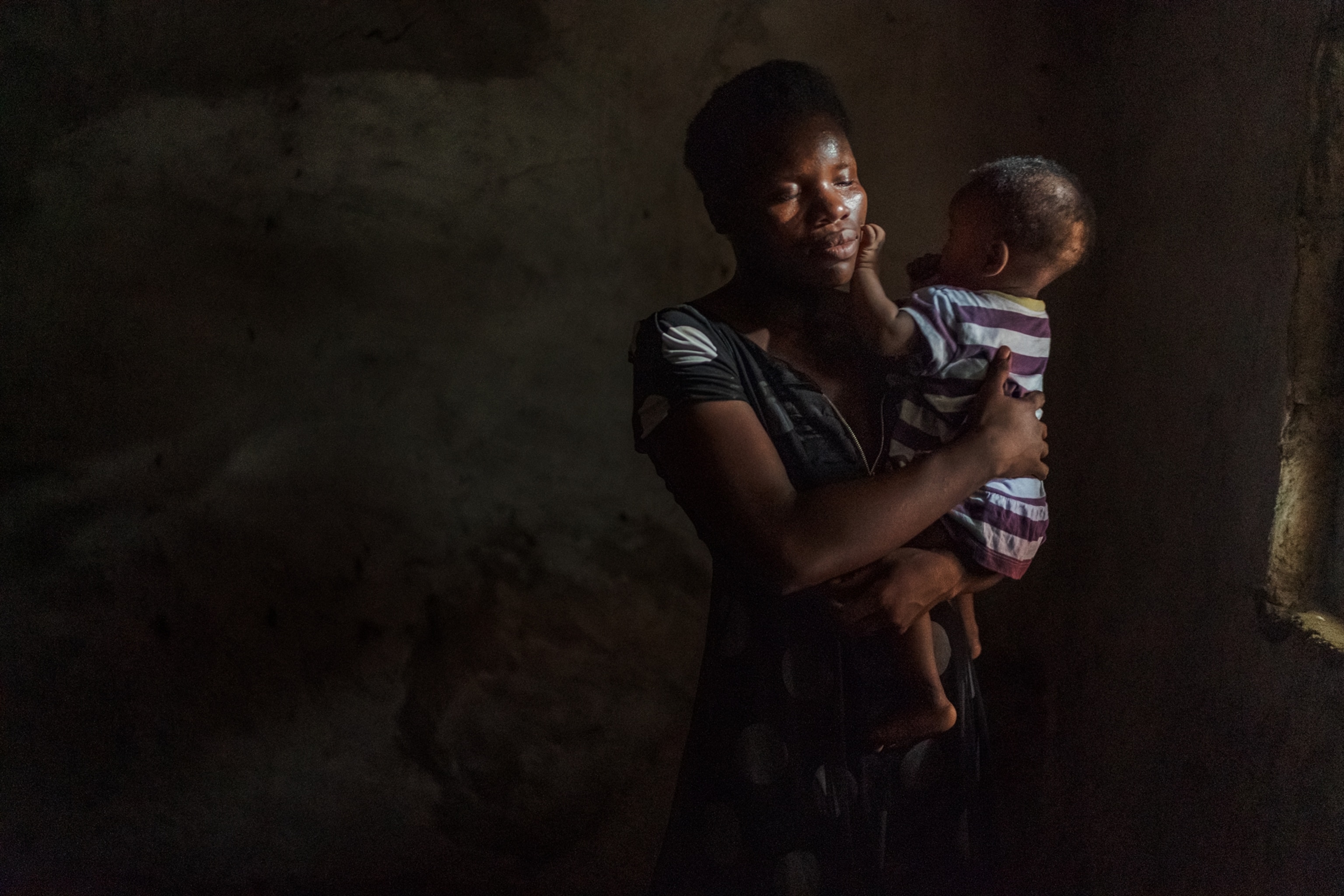 A mother tending to a baby