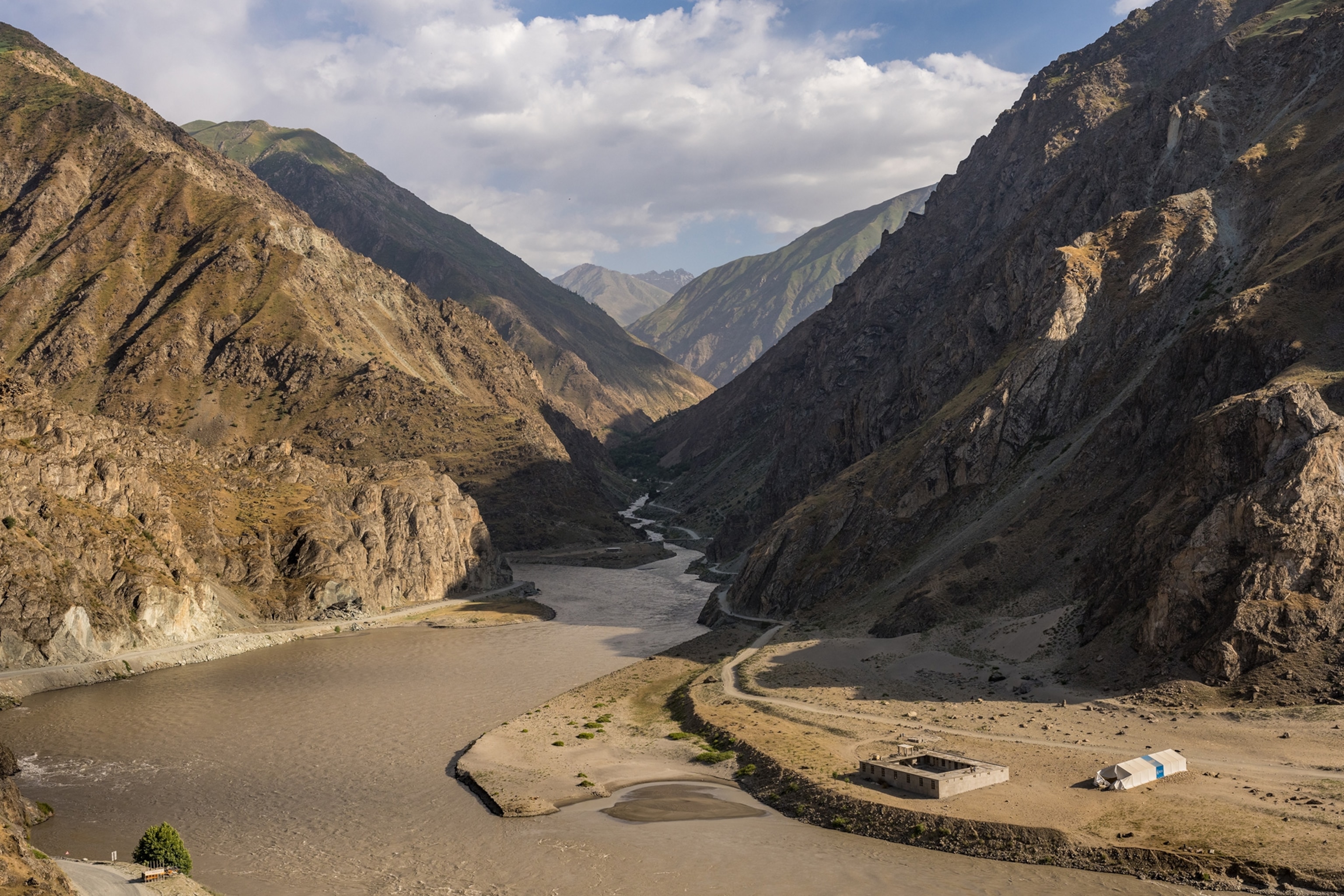 The Panj River weaves its way through the mountains in Tajikistan.