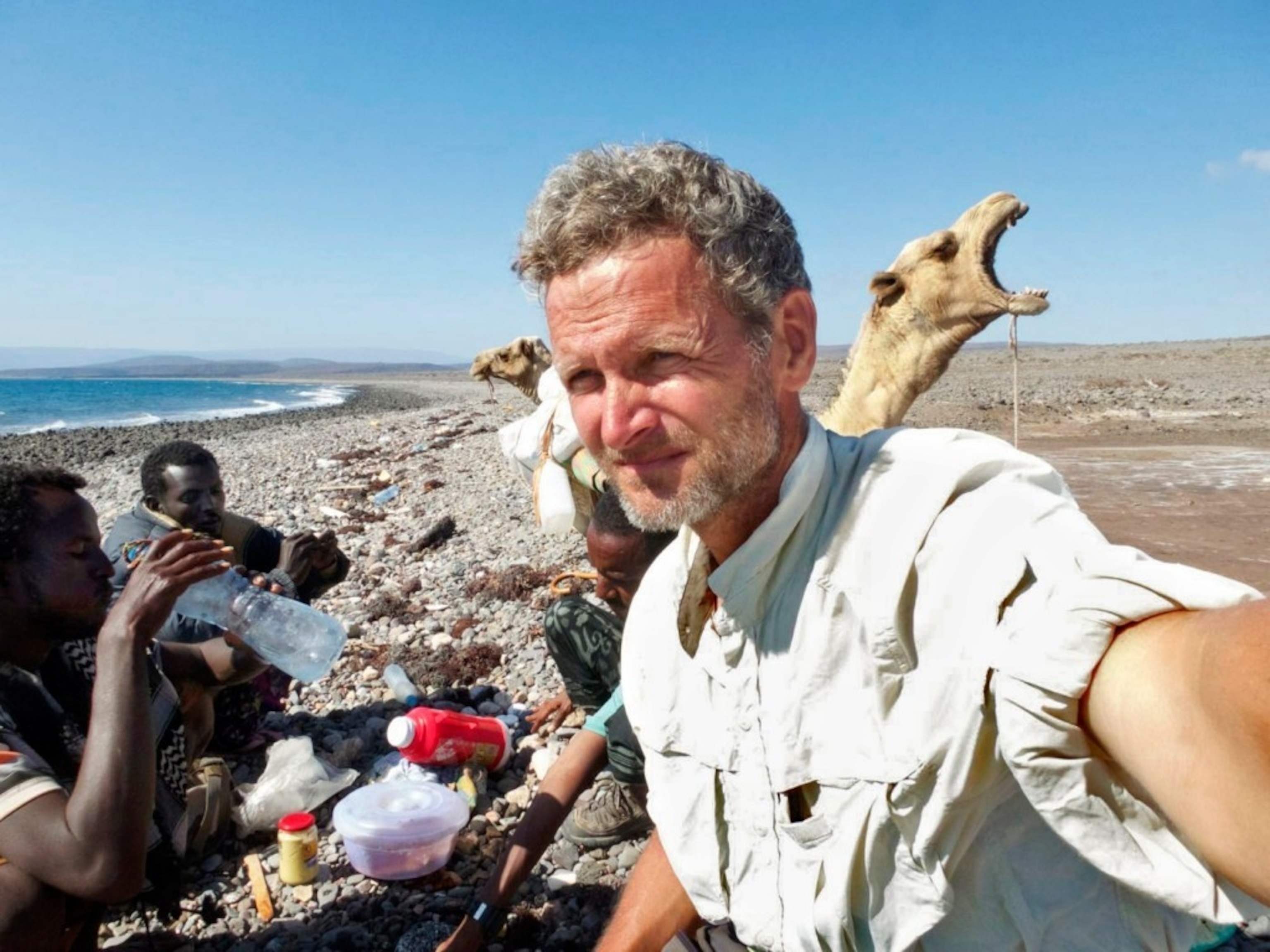 'Tea by the Red Sea. Modaita, the yawning camel, is unimpressed,' writes Salopek.