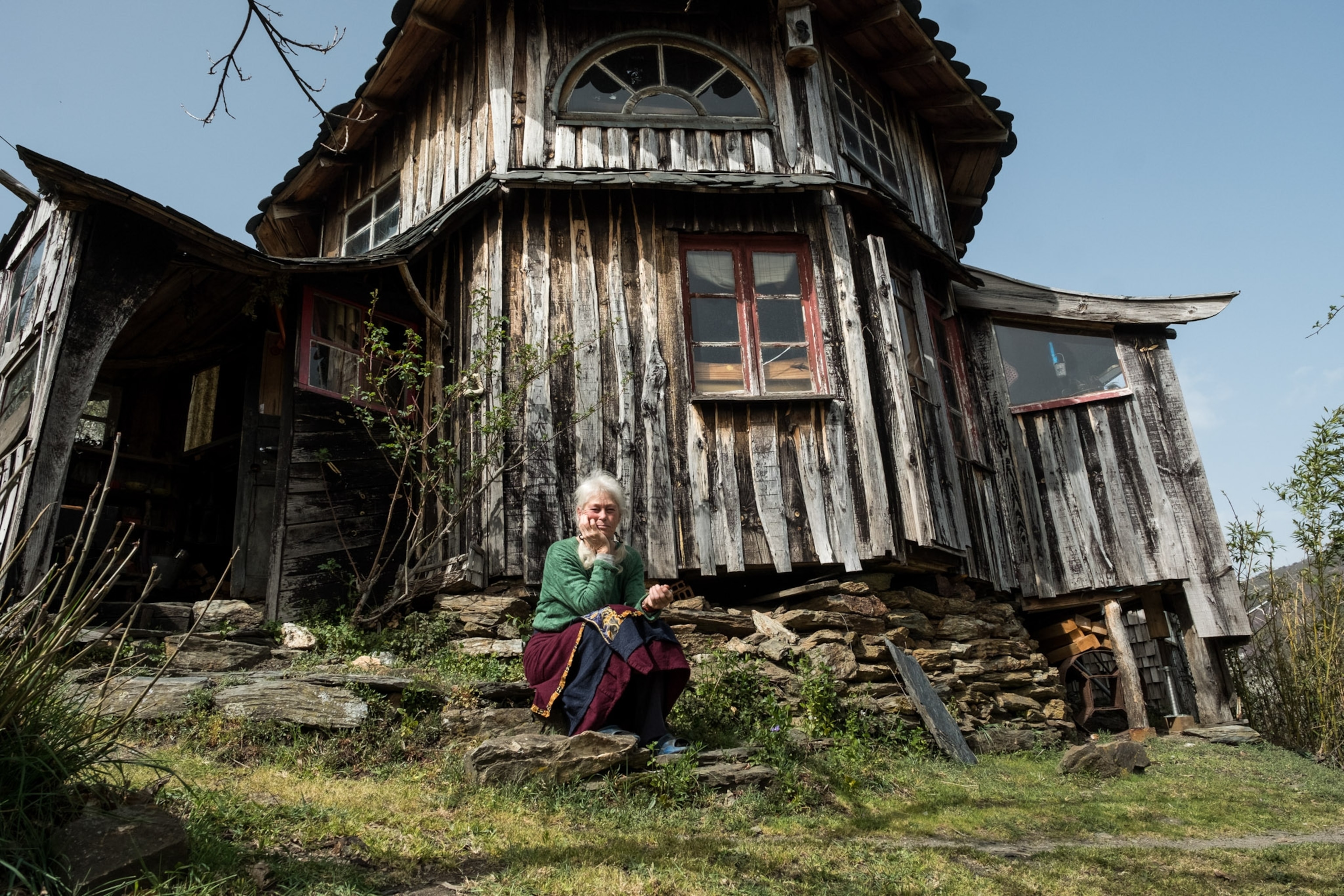 Portrait of a woman on a front porch step