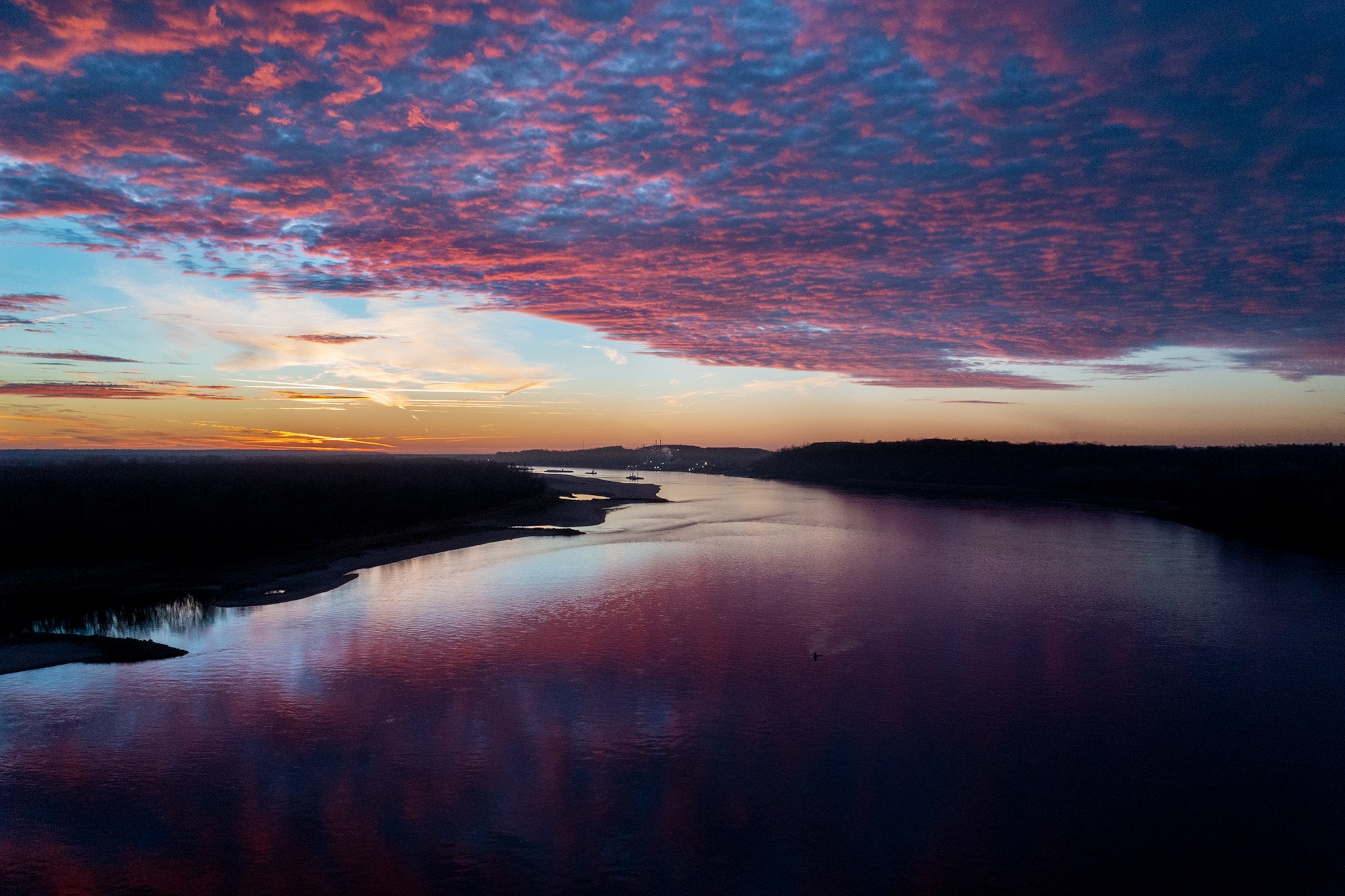 Drone image of the Mississippi River at sunset.
