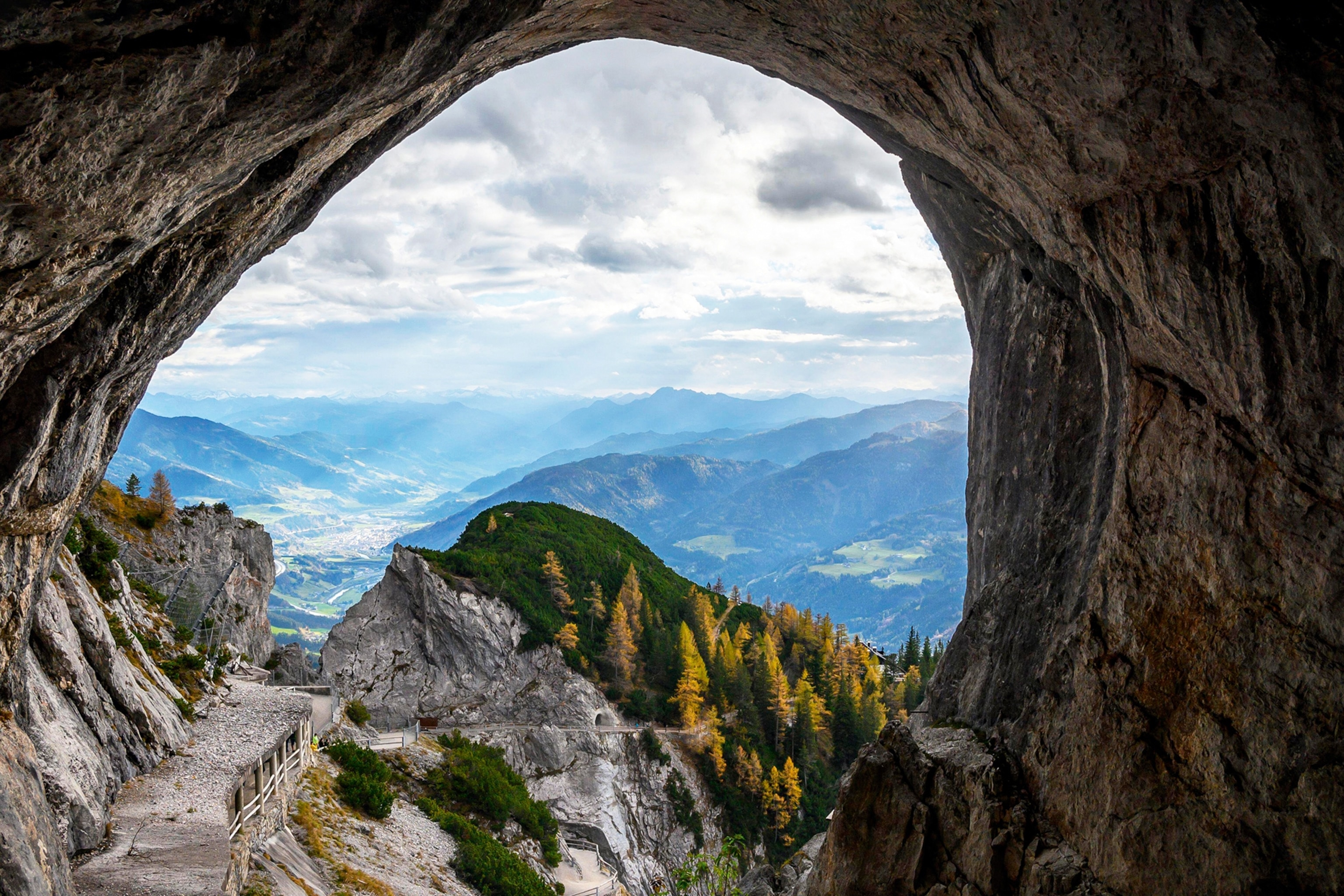 The view of Werfen from the inside of an ice cave, which has a rough, rocky texture.