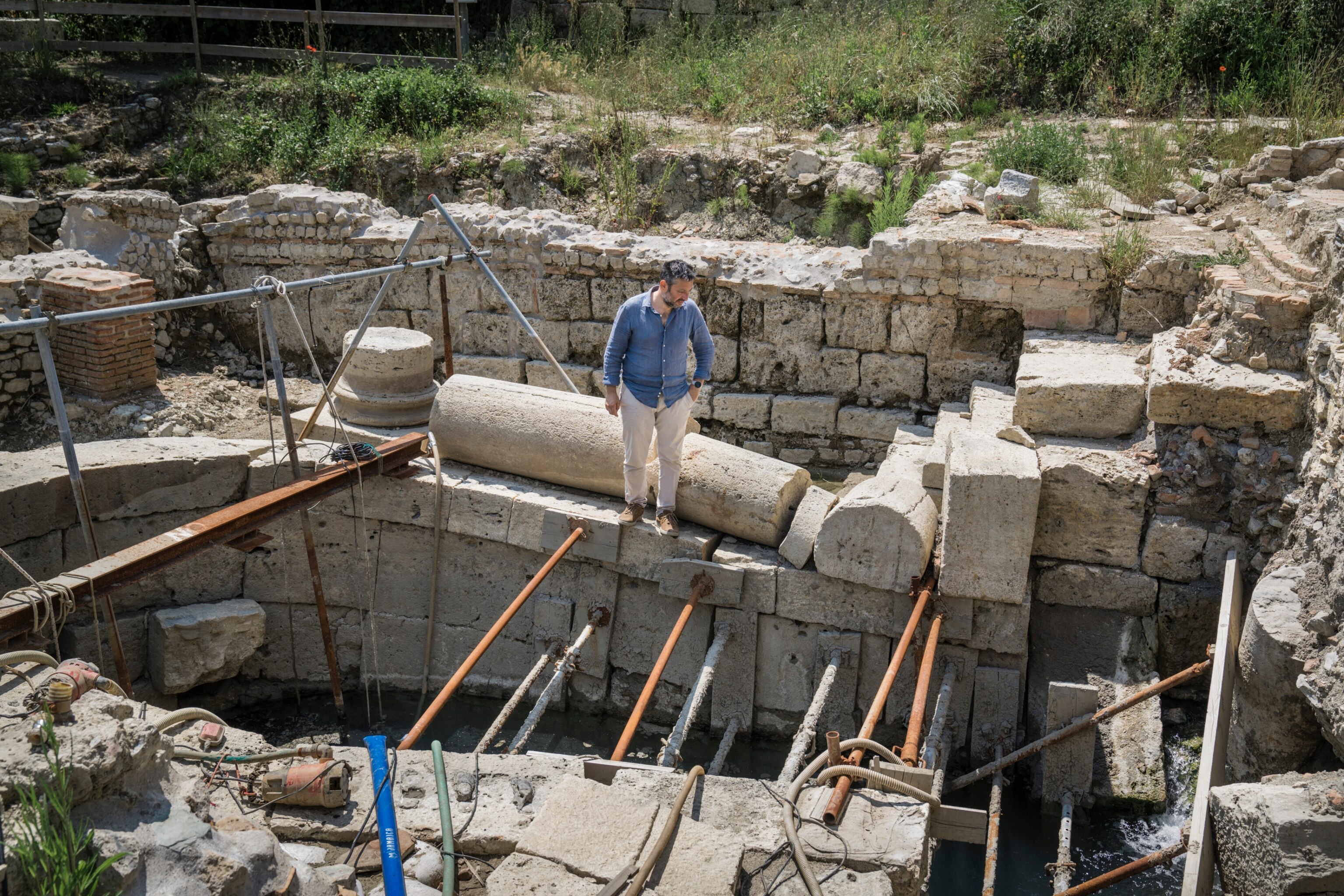 a man by the director of the excavation site