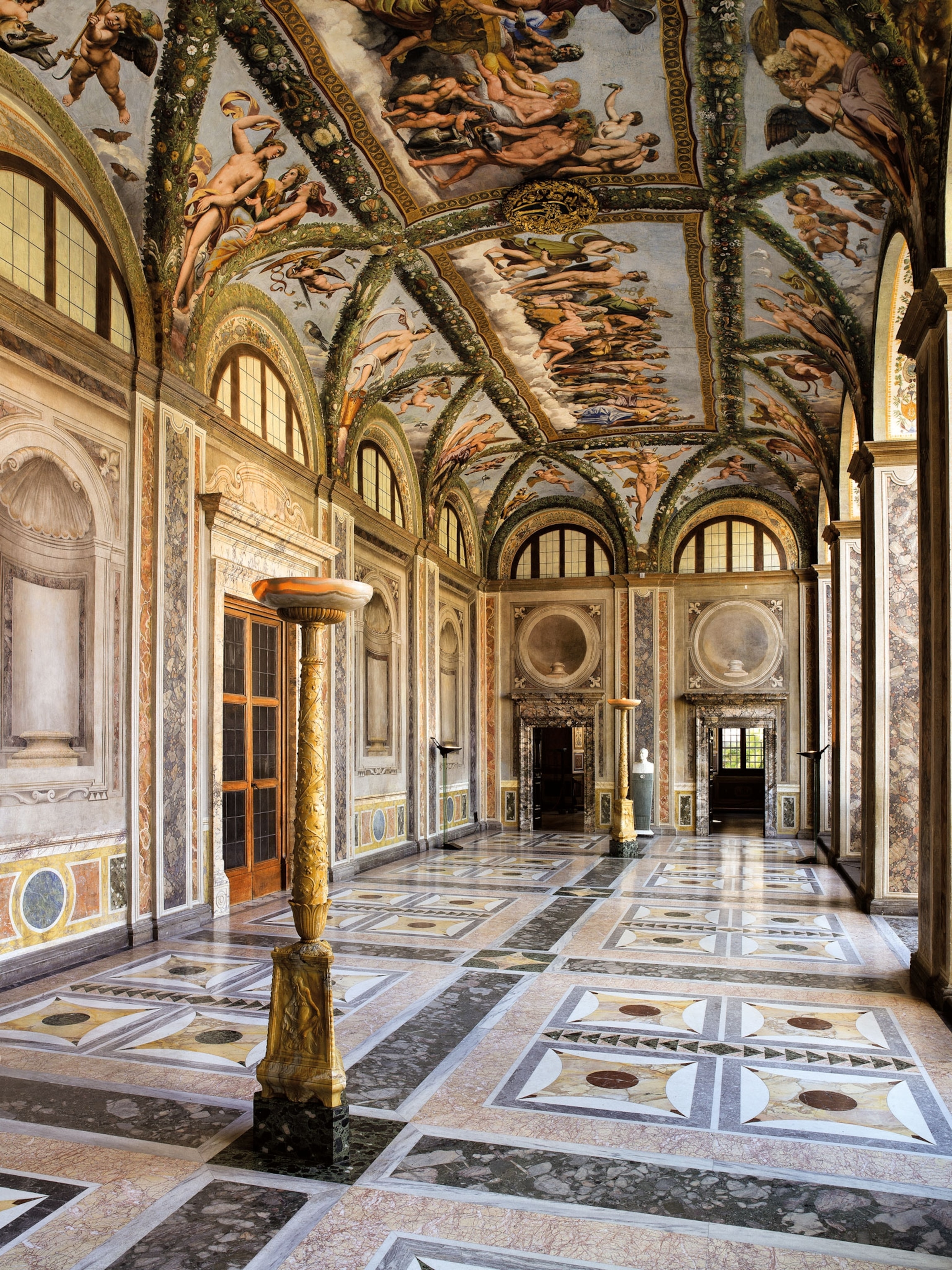 An ornate room with a painted ceiling