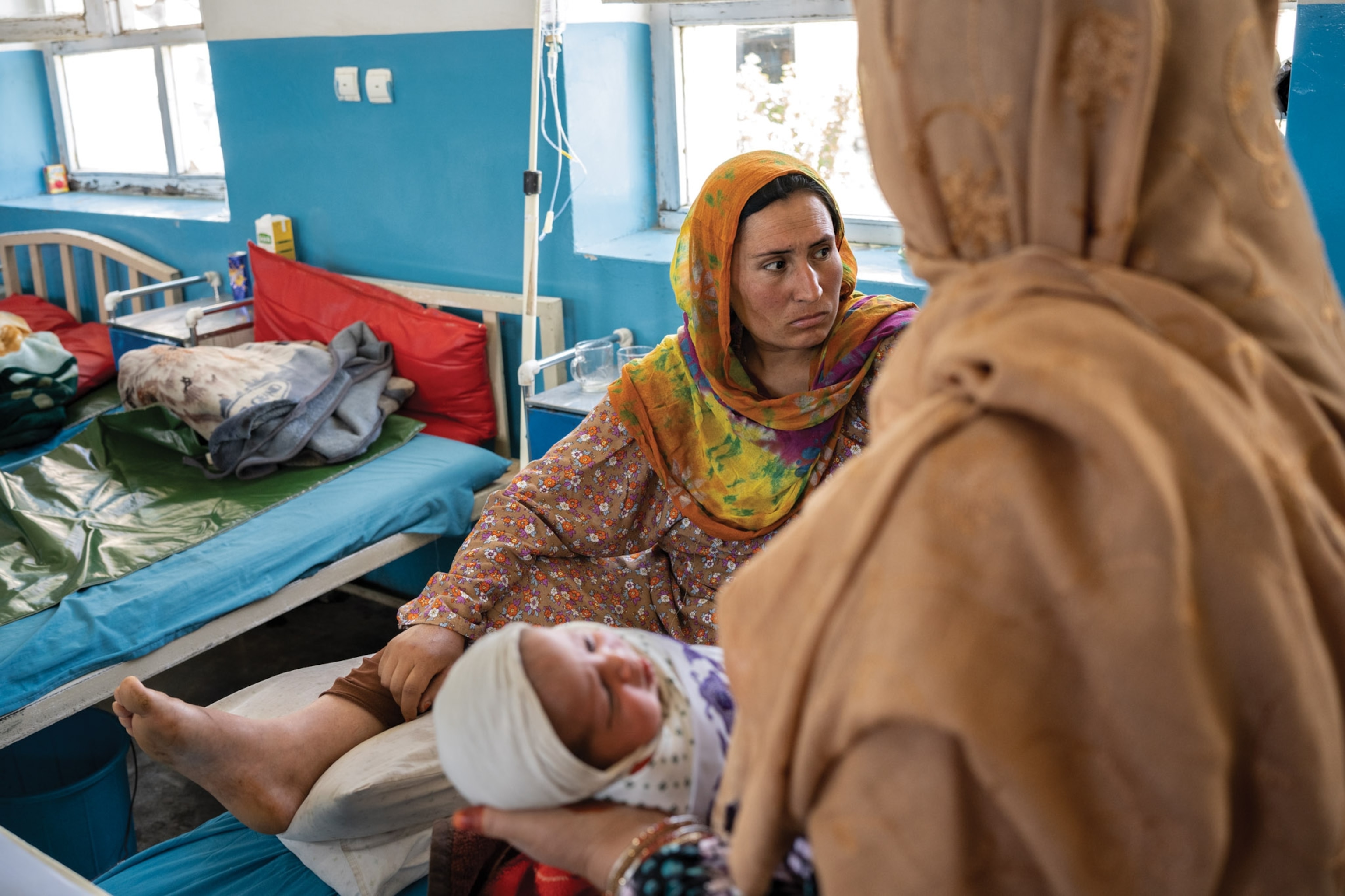A woman lays after delivering a child