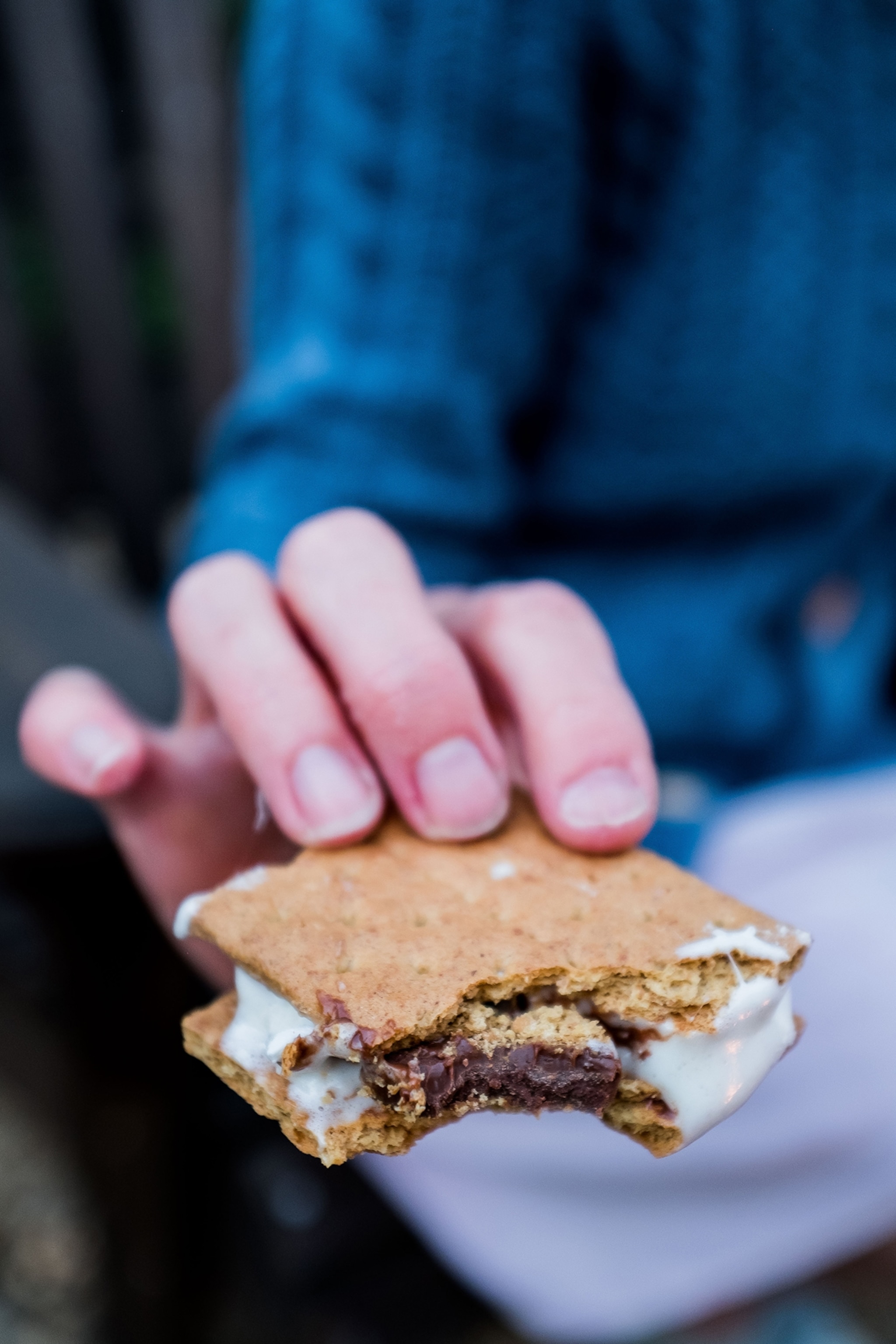 Smores around the fire at the Sandy Pines Campground, Kennebunkport / Goose Rocks Beach, that has park models, glamping tents, RV sites, tent sites.