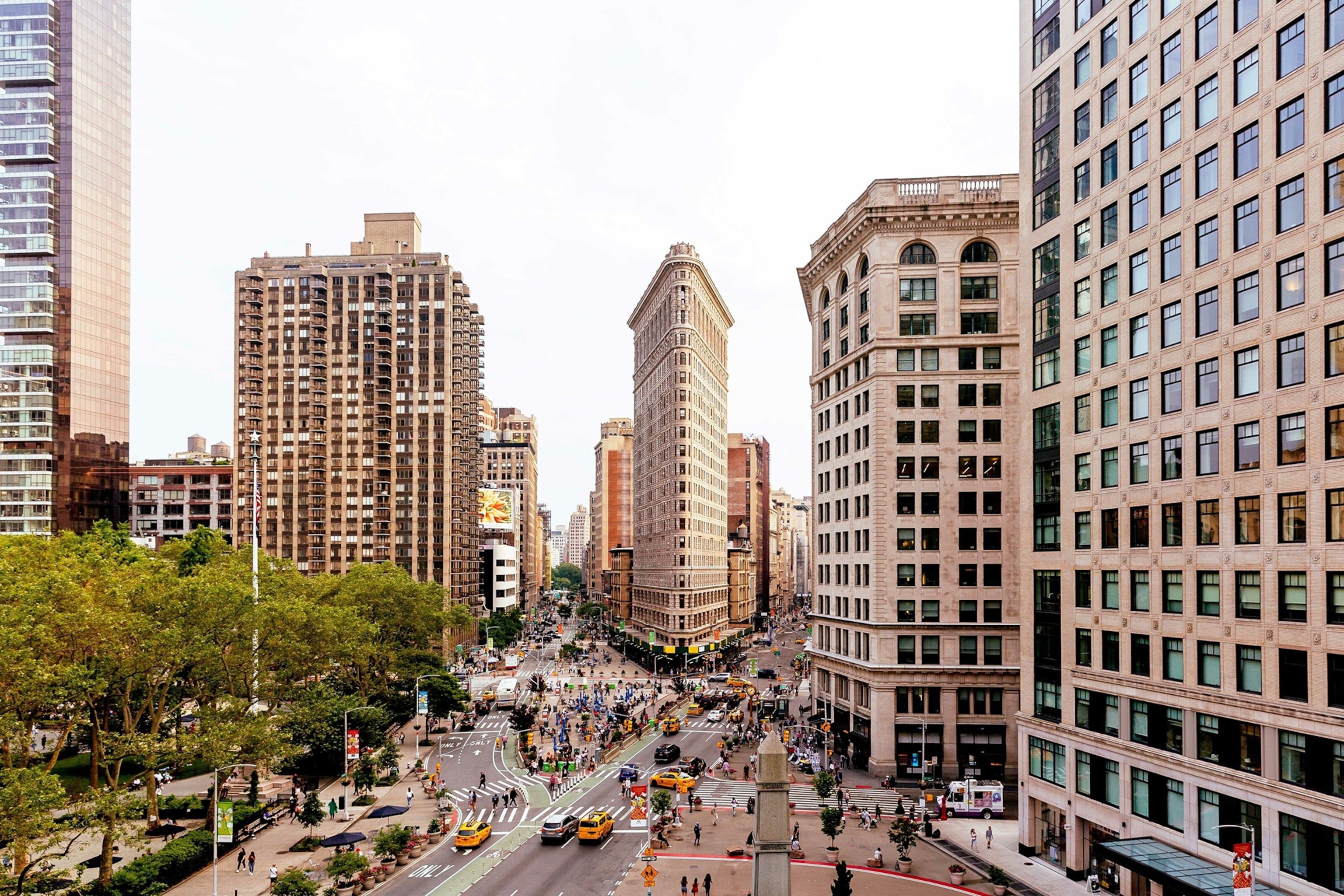 The Flatiron Building and streets of New York City, near Madison Square Park.