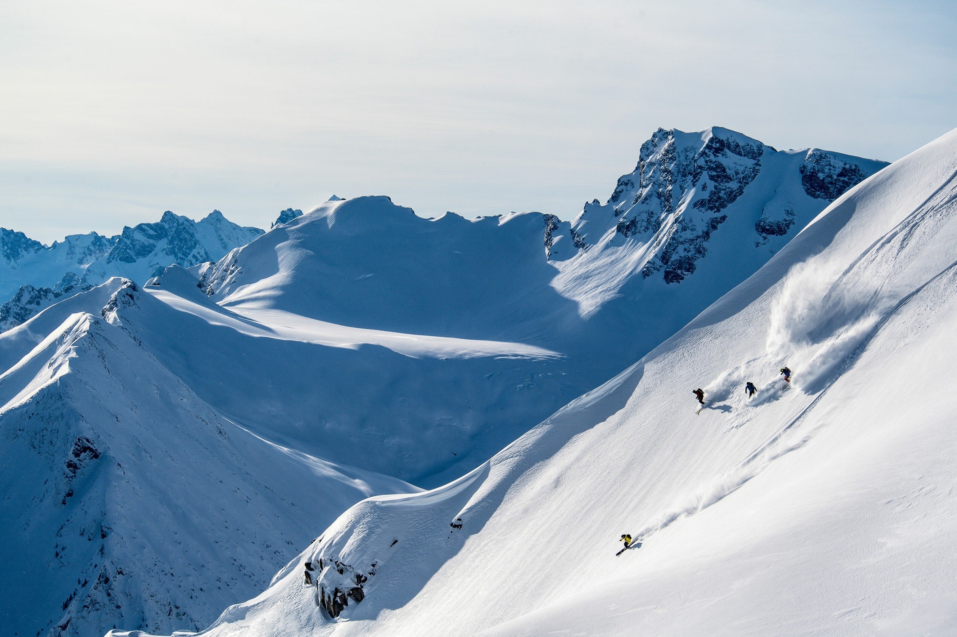 Skiers make a first descent into the powdery snow of Bella Coola Valley.