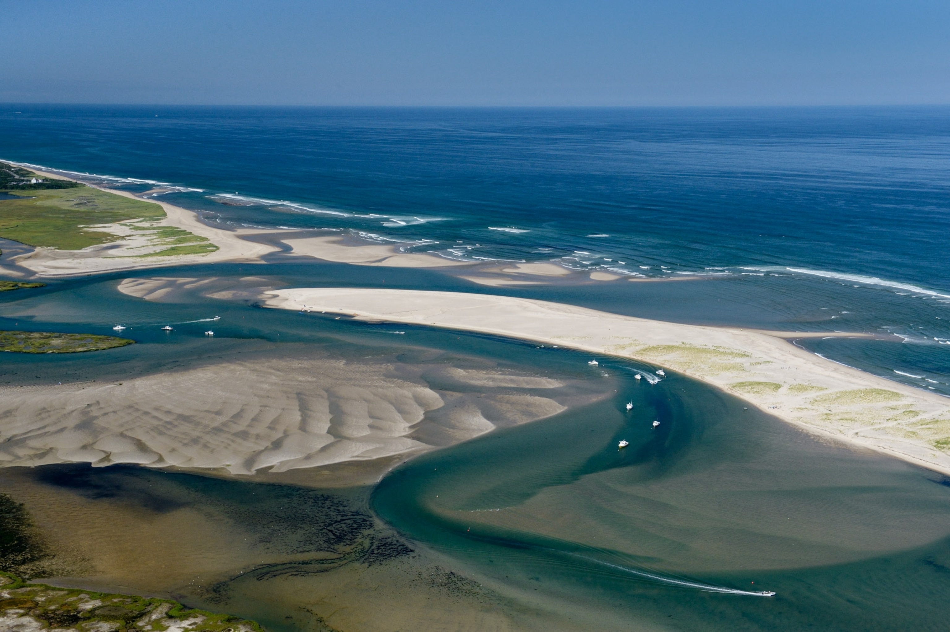 Boats along twisting waters ways by the coast.