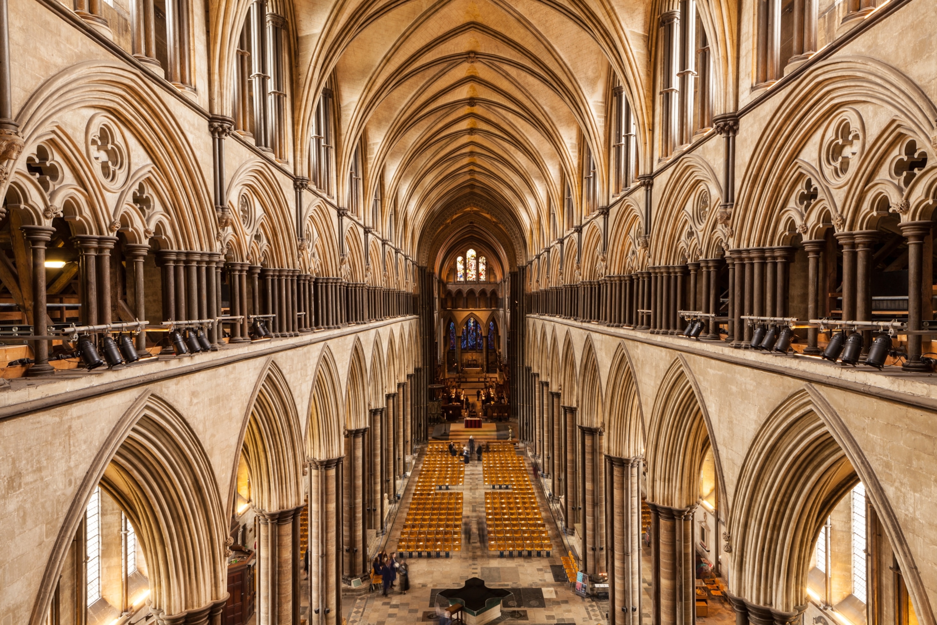 Interior view of Salisbury cathedral, repeating patterns of windows and stone walls