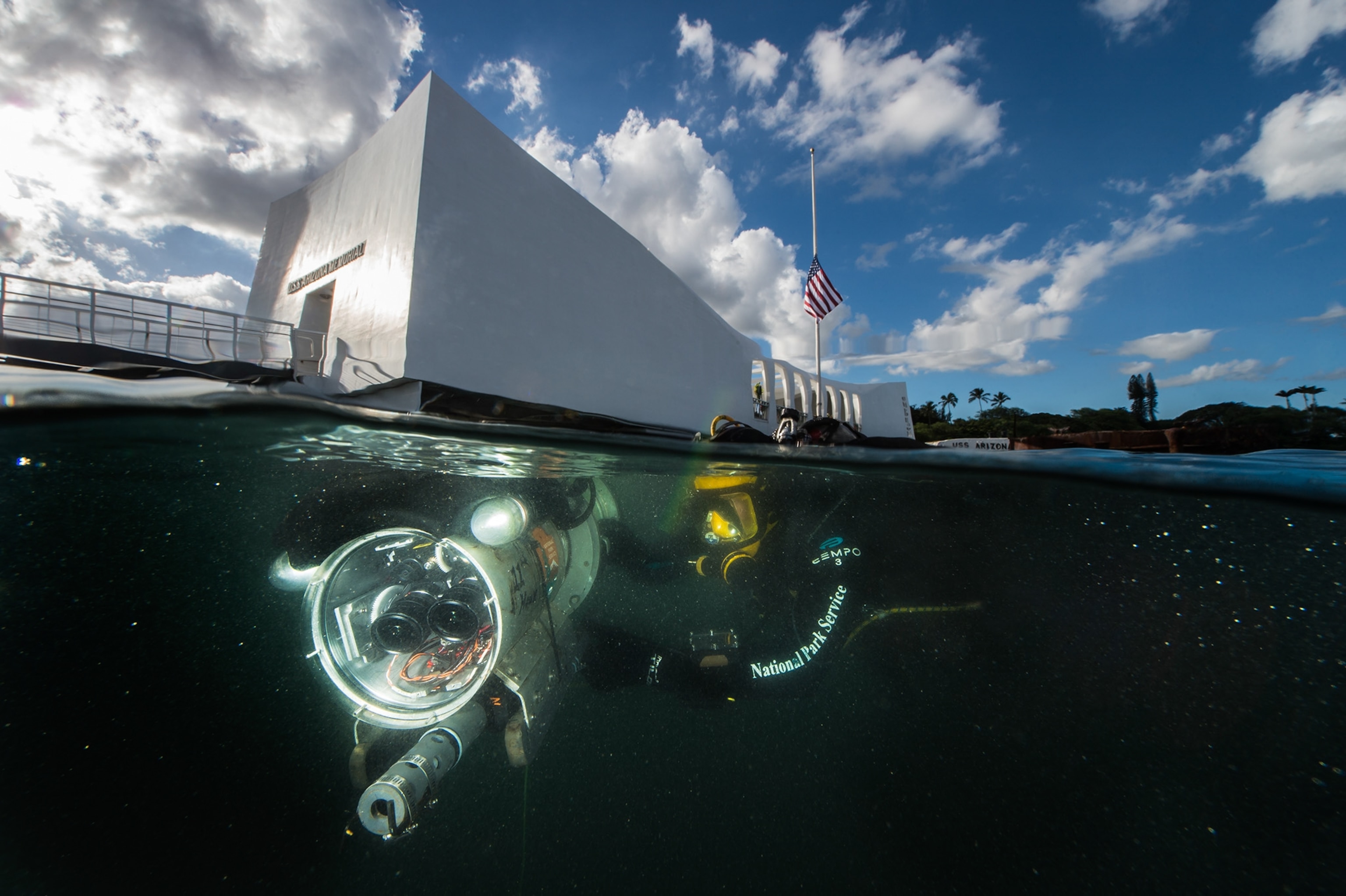 ROV being submerged in front USS Arizona memorial