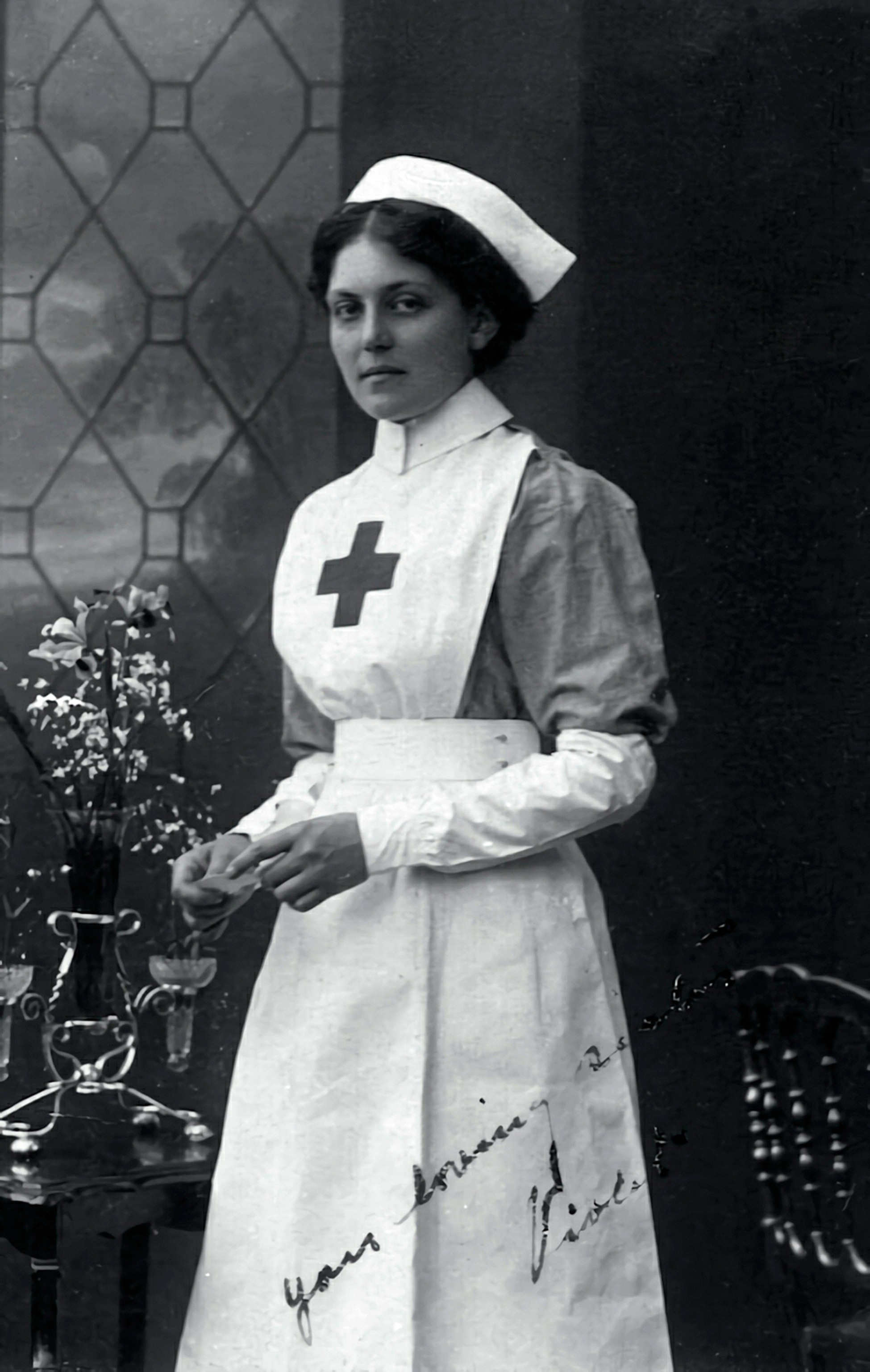 Photo of woman wearing a uniform and hat