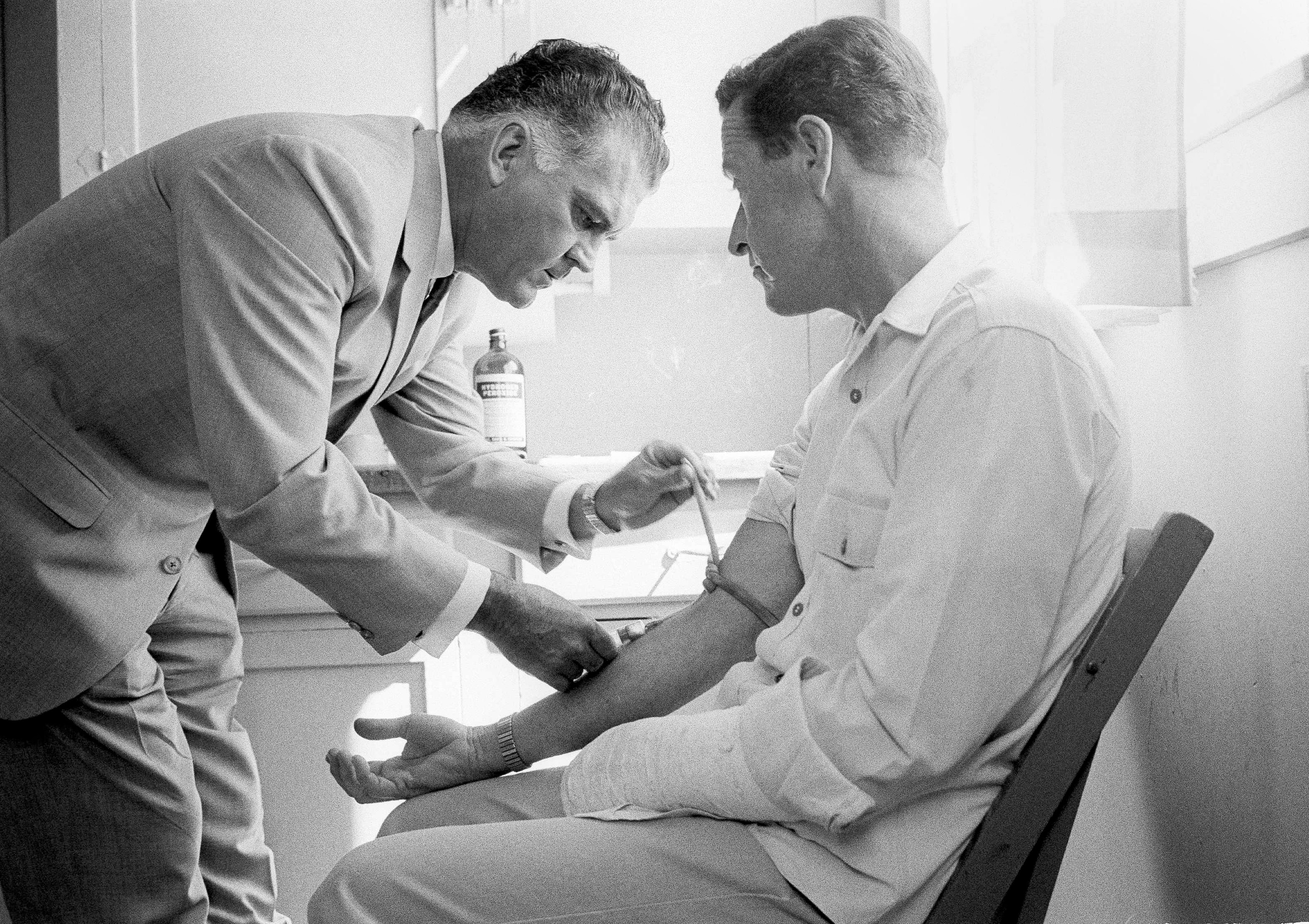 An archival photo of a volunteer undergoing LSD research project at an honor camp in 1966