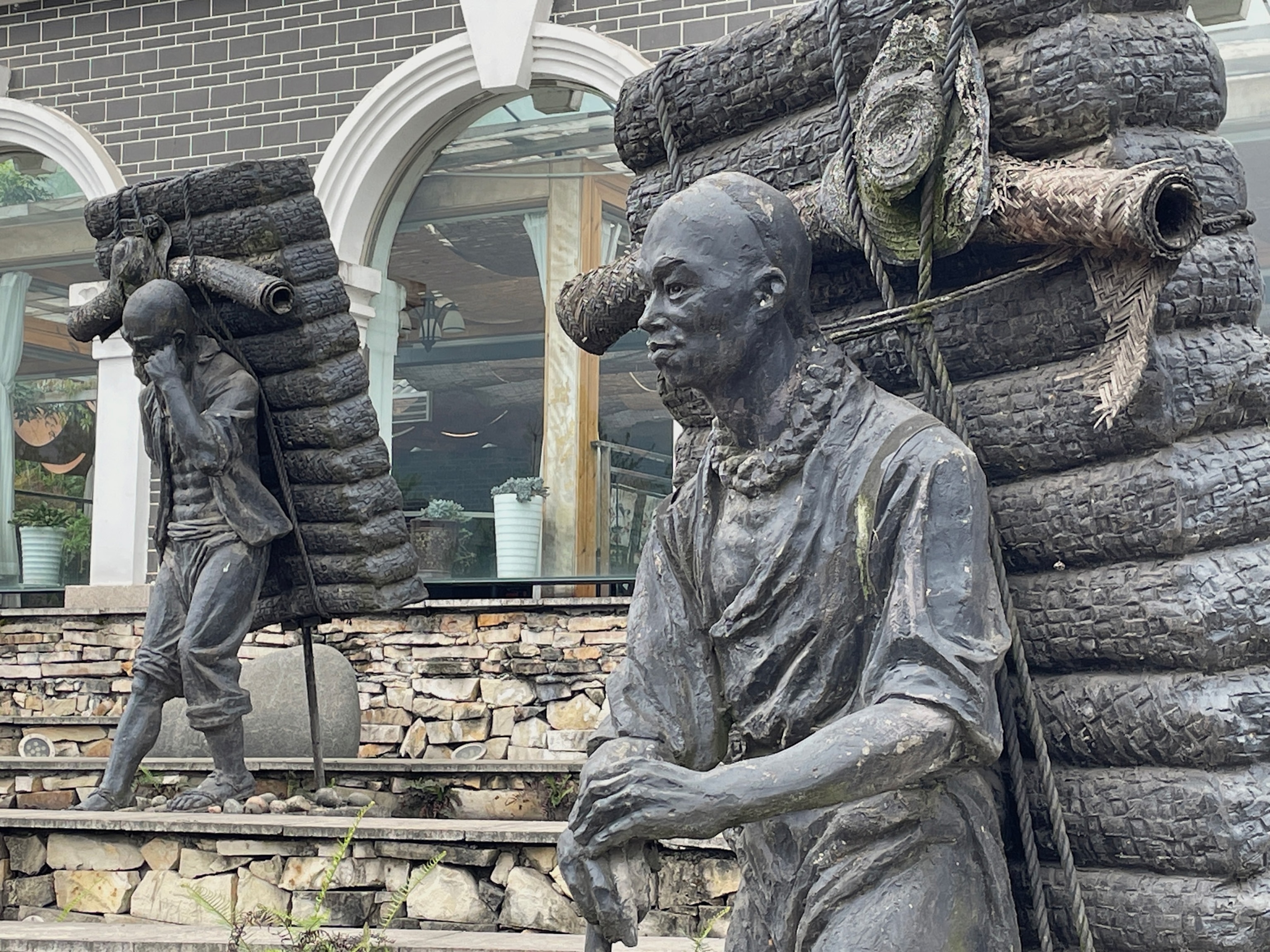 Photo of two statues of tea porters