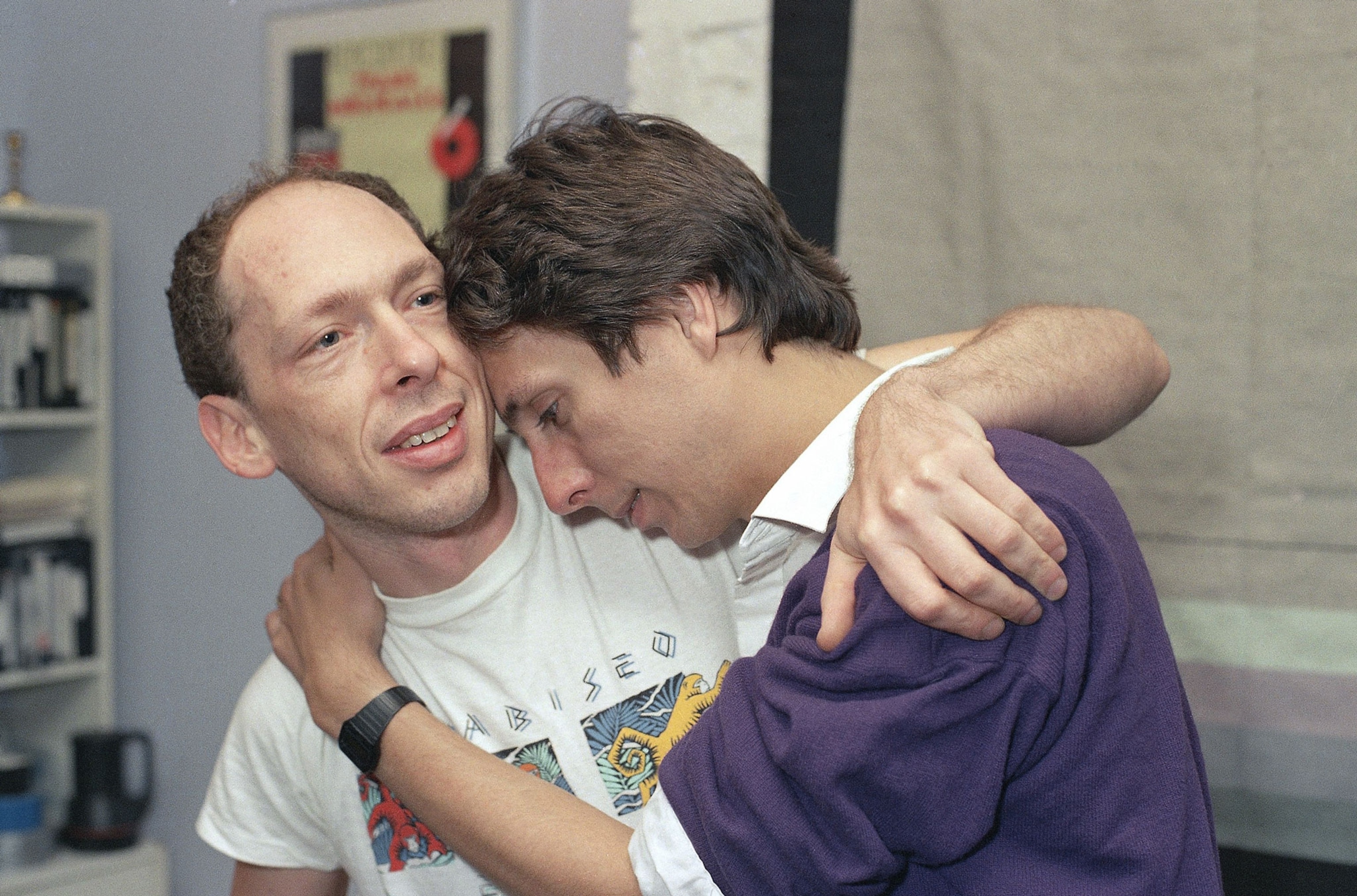 an archival photograph of Micael Callen being comforted by his partern
