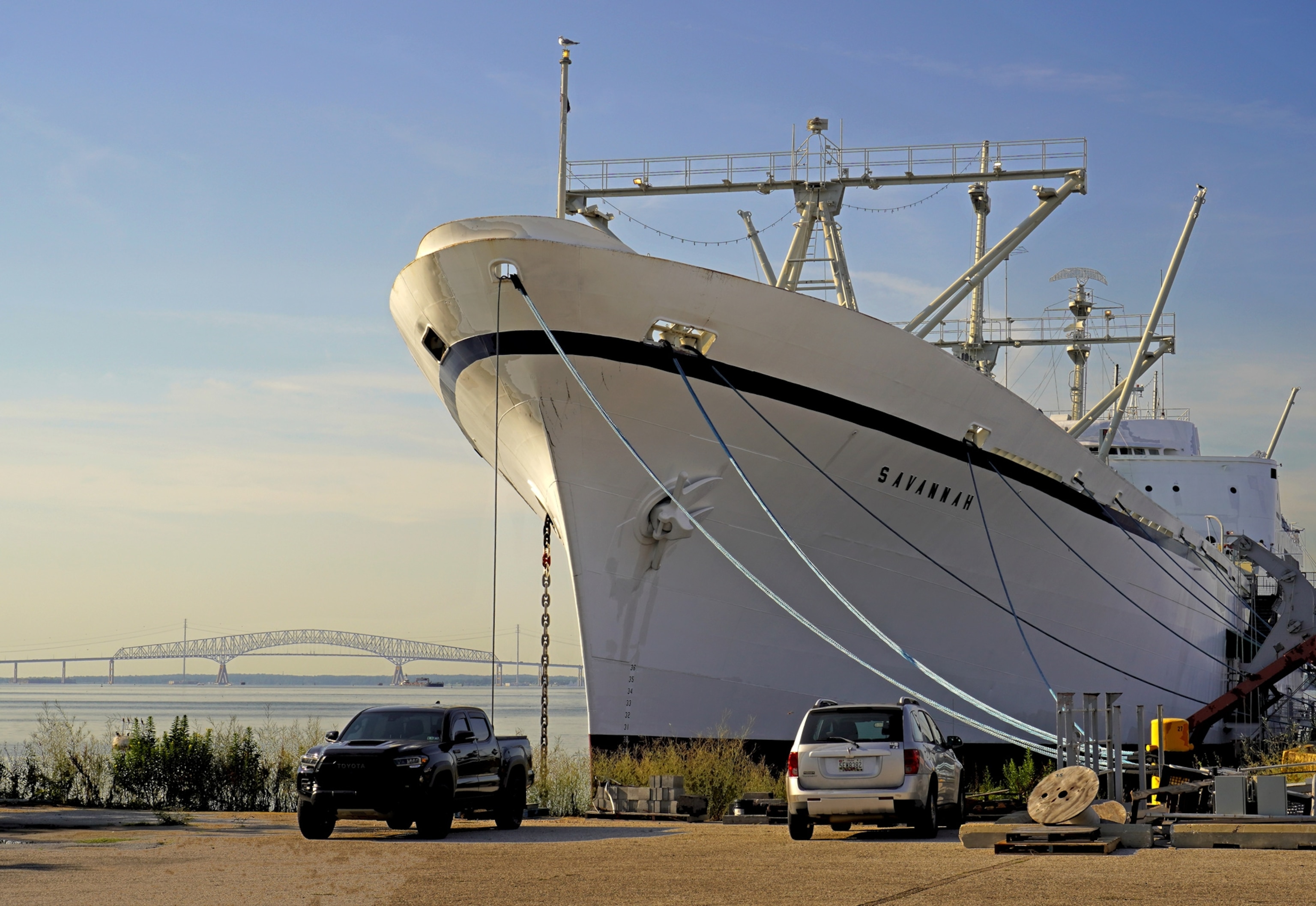 Photo of large white ship docked at harbor