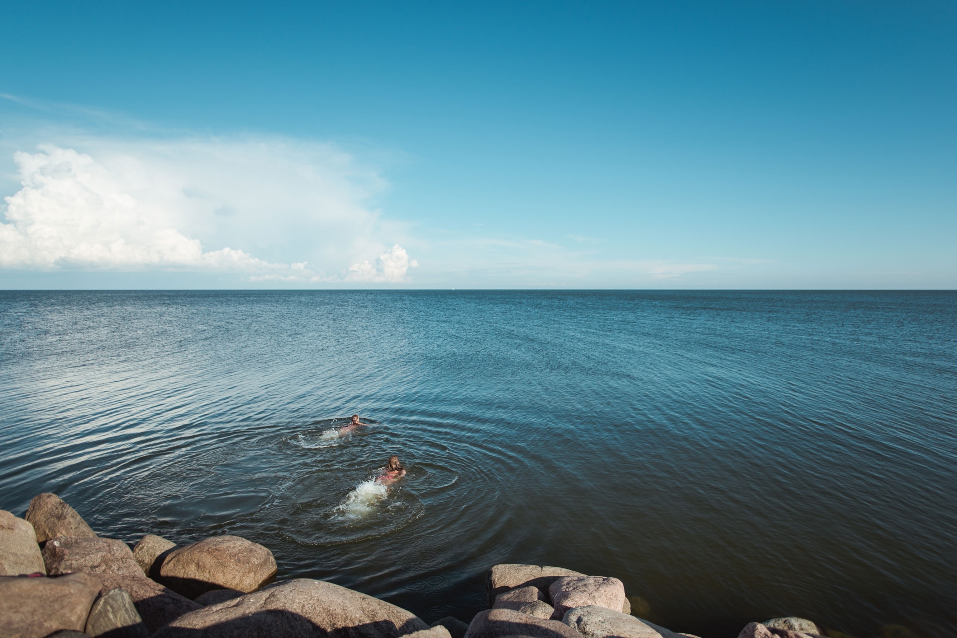 two people swimming