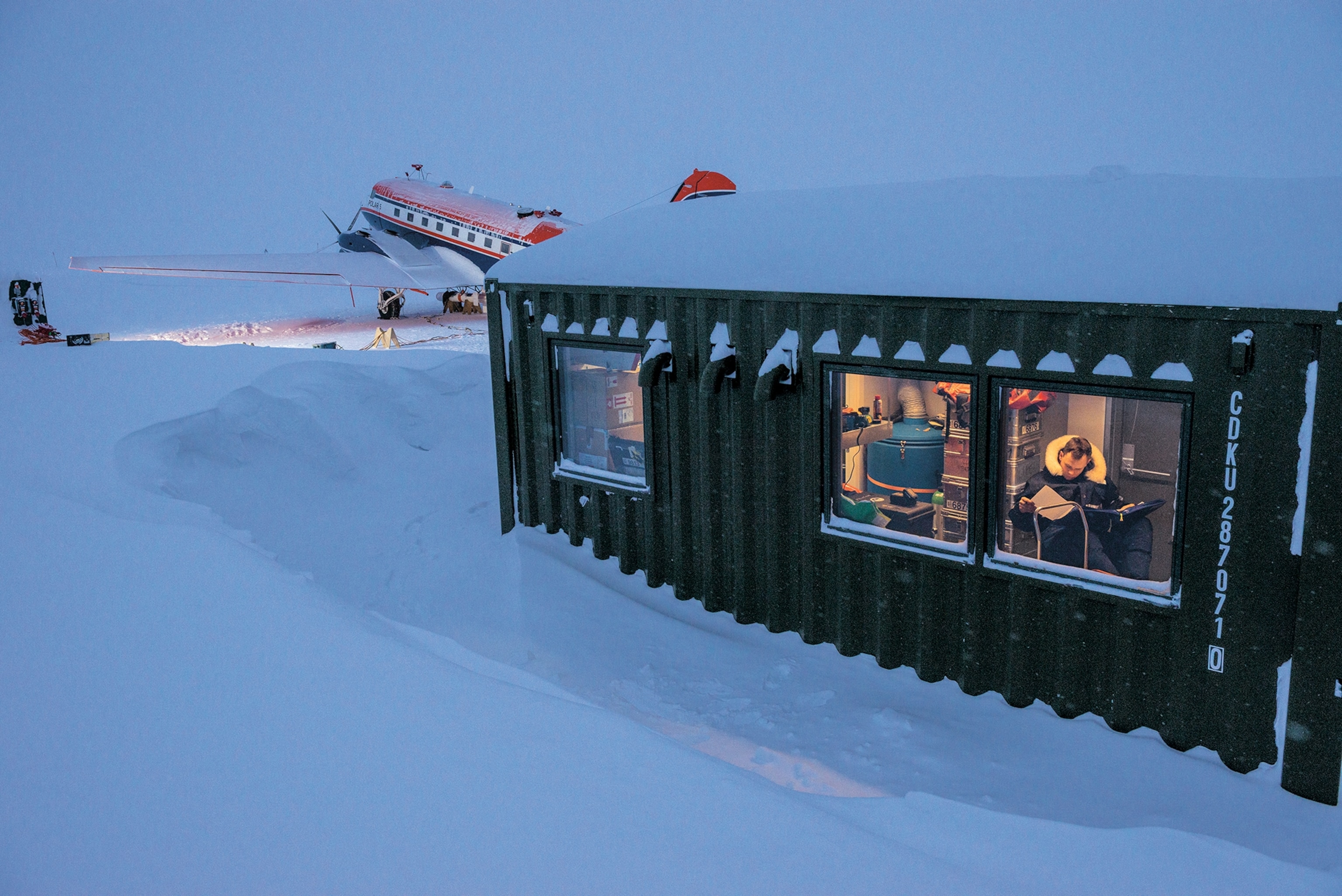 a research plane and a scientist preparing for the next flight mission