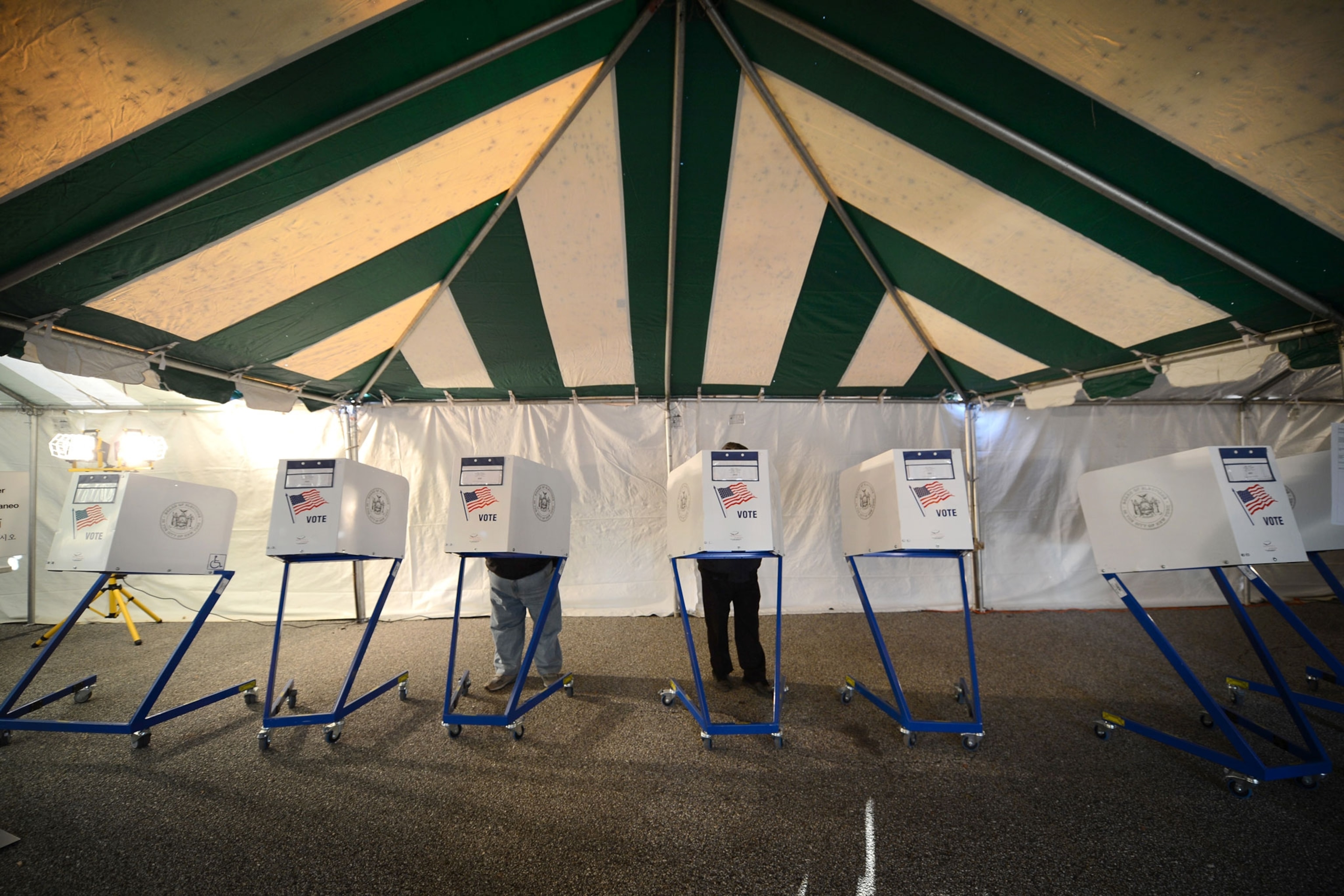 voting booths set up in a makeshift tent