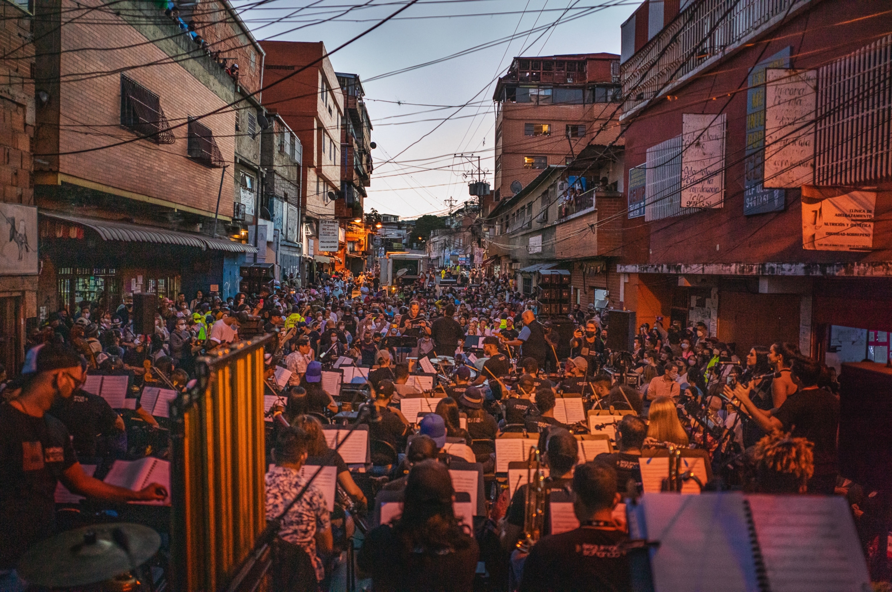 members of an orchestra in Venezuela play a concert outside