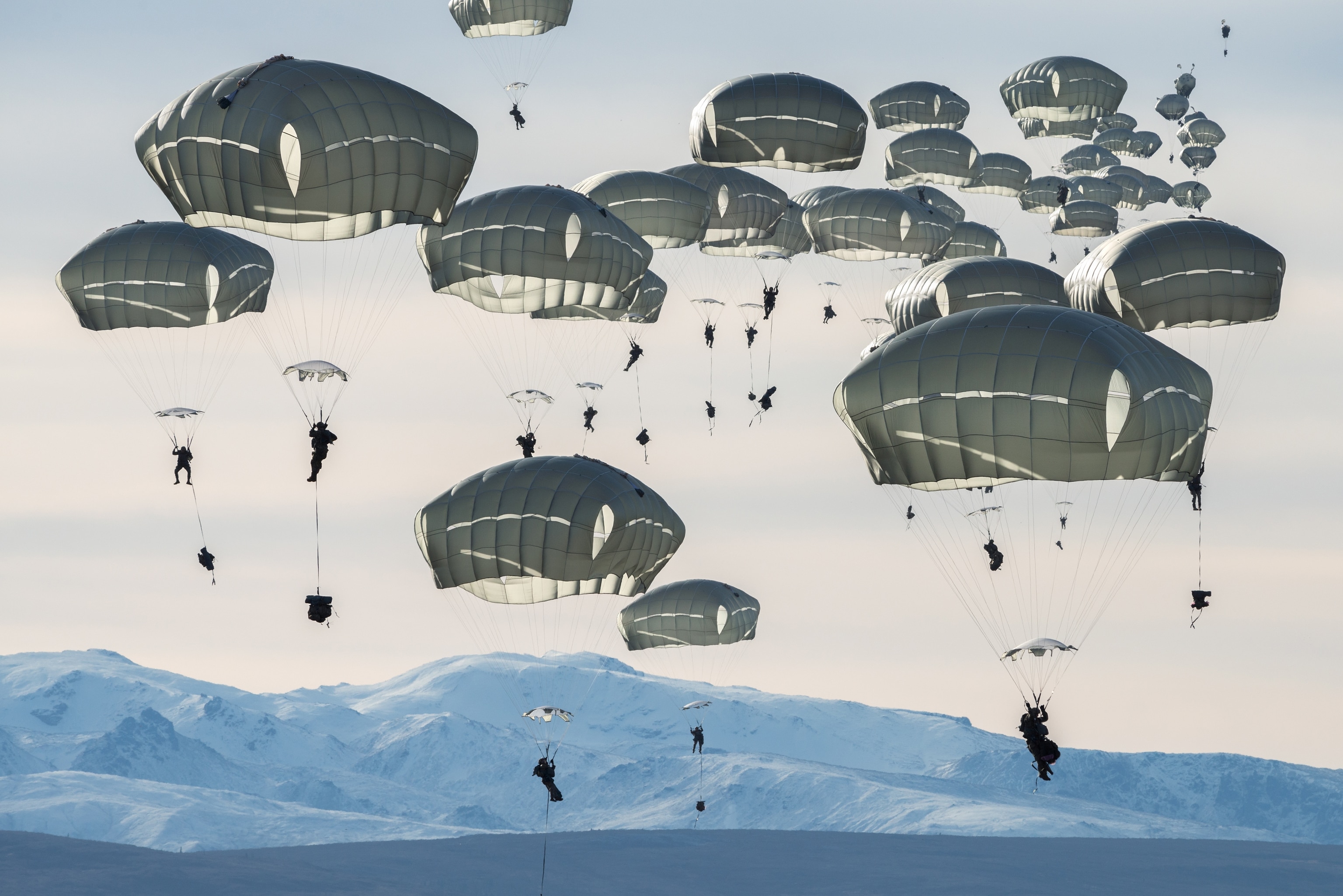 army unit landing on parachutes