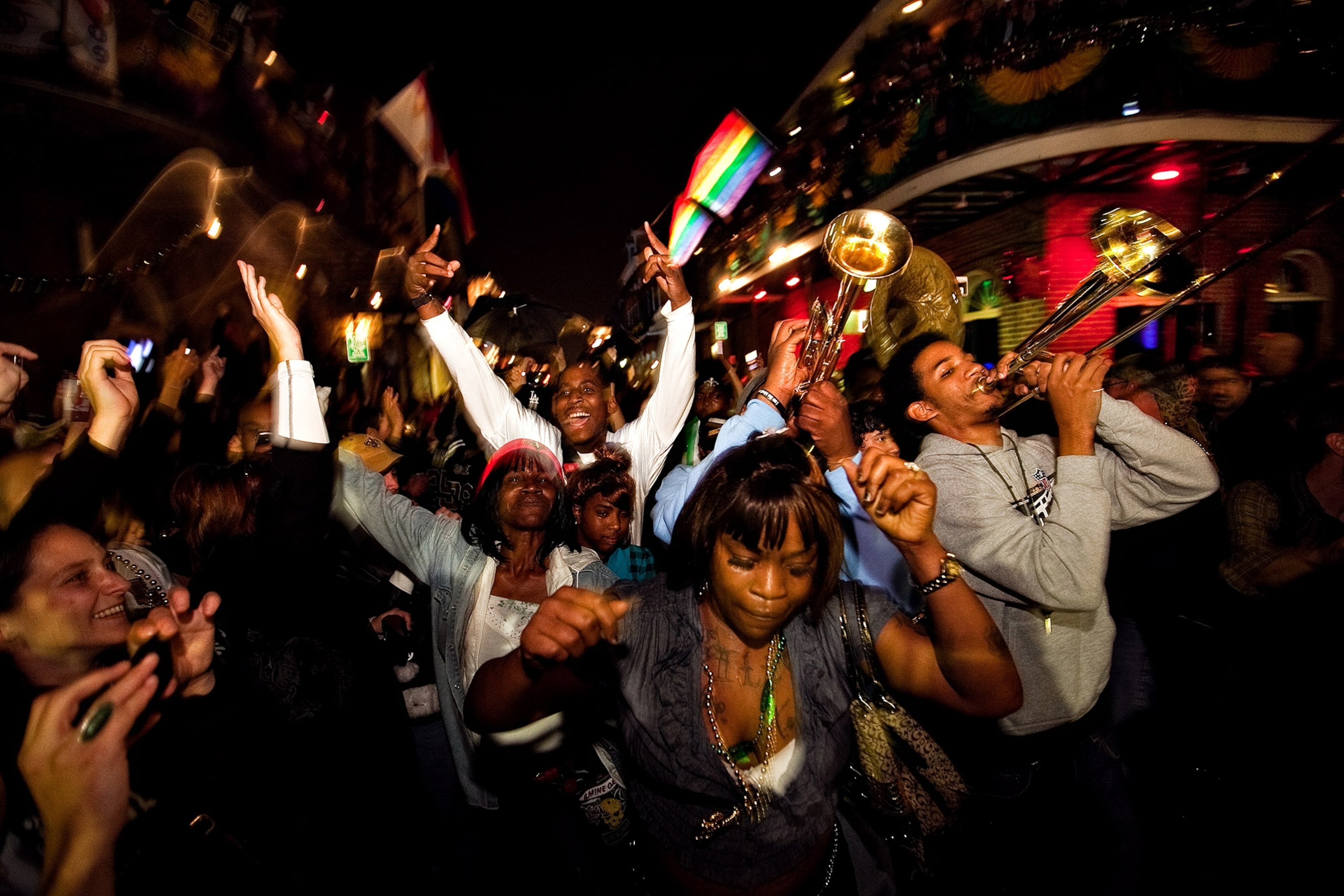 People dance and play trumpet in the streets of New Orleans, Louisiana.