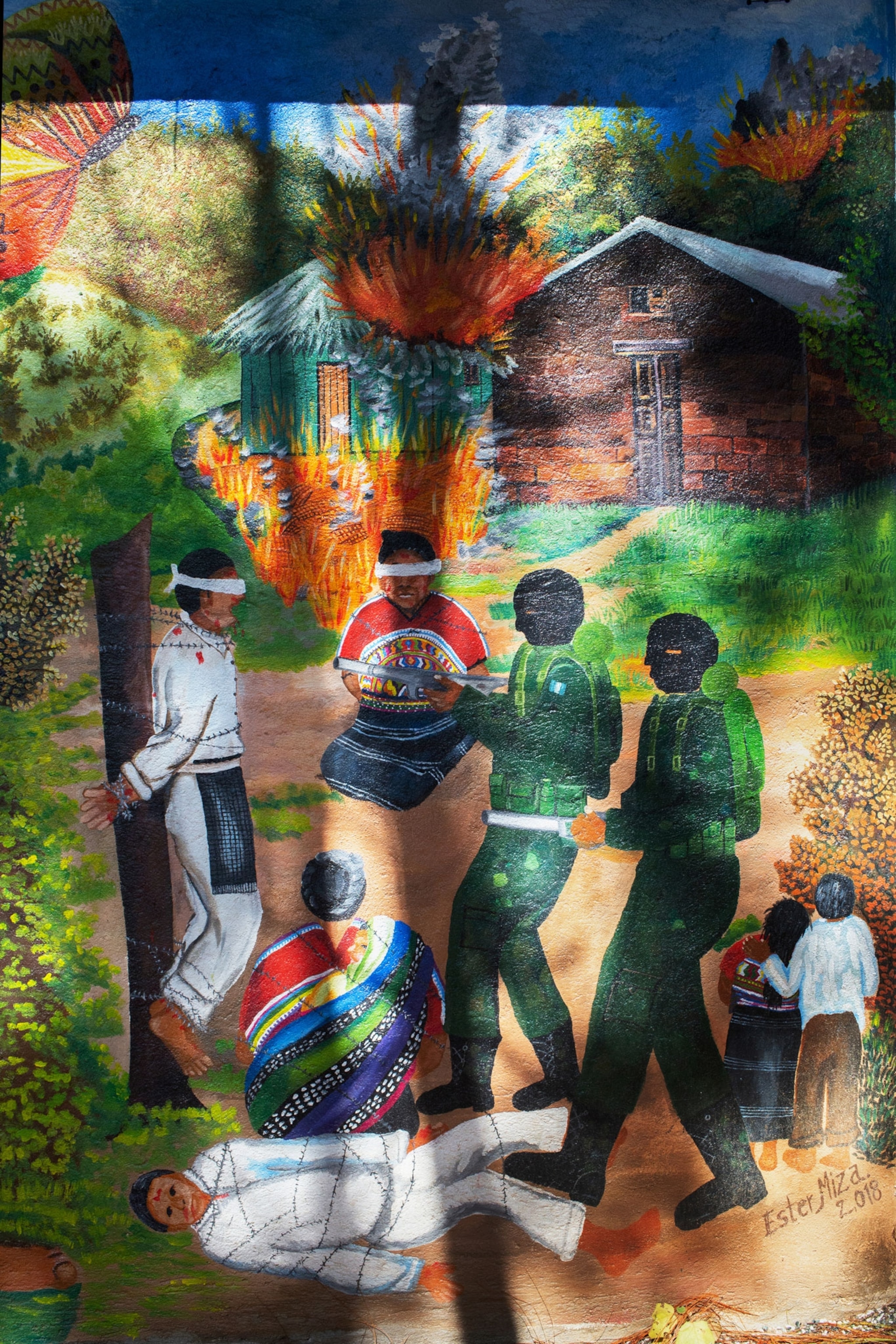 a mural showing a massacre in Guatemala