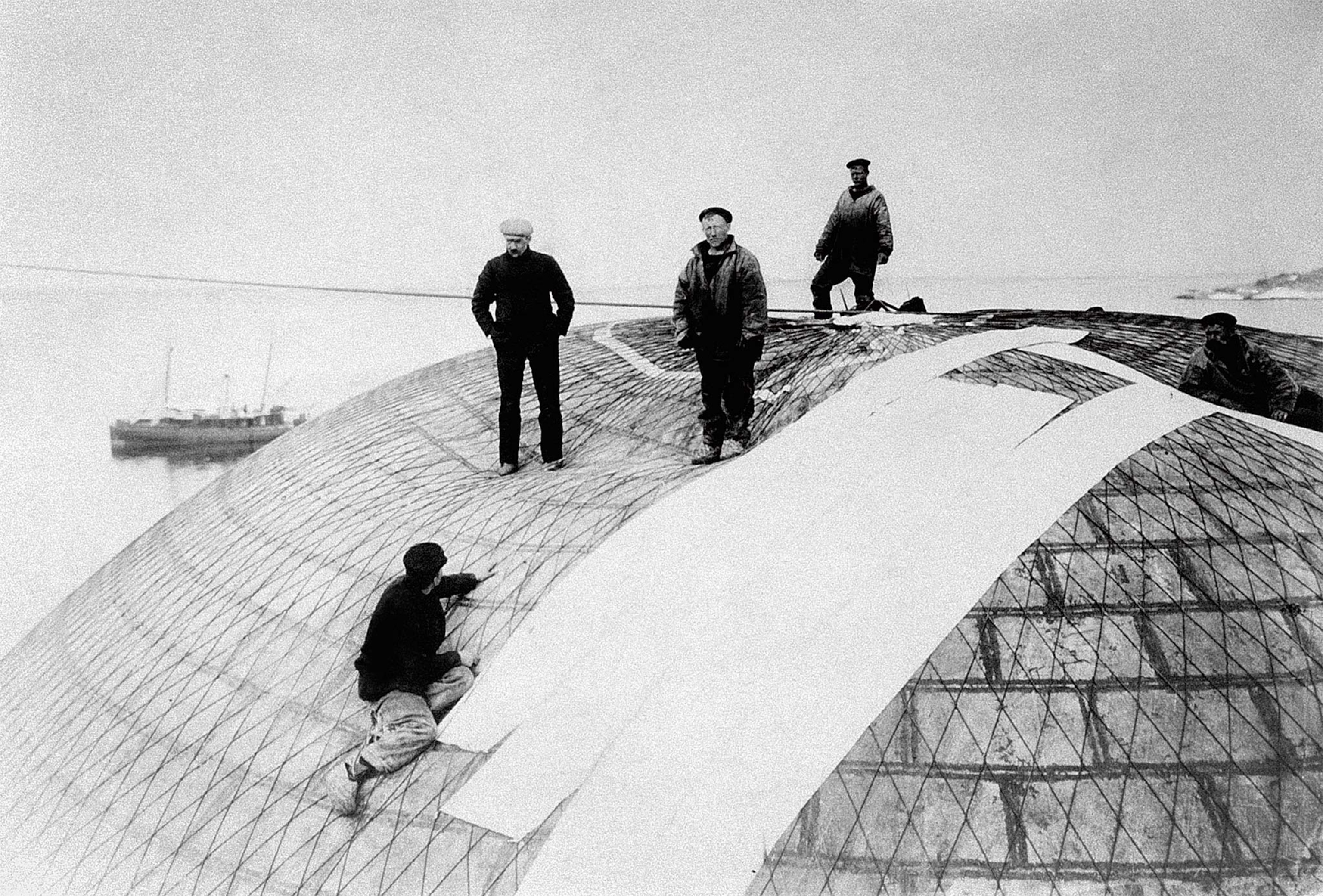 Workmen examine the fabric of Andrée’s balloon on Danskøya, or Danes Island).