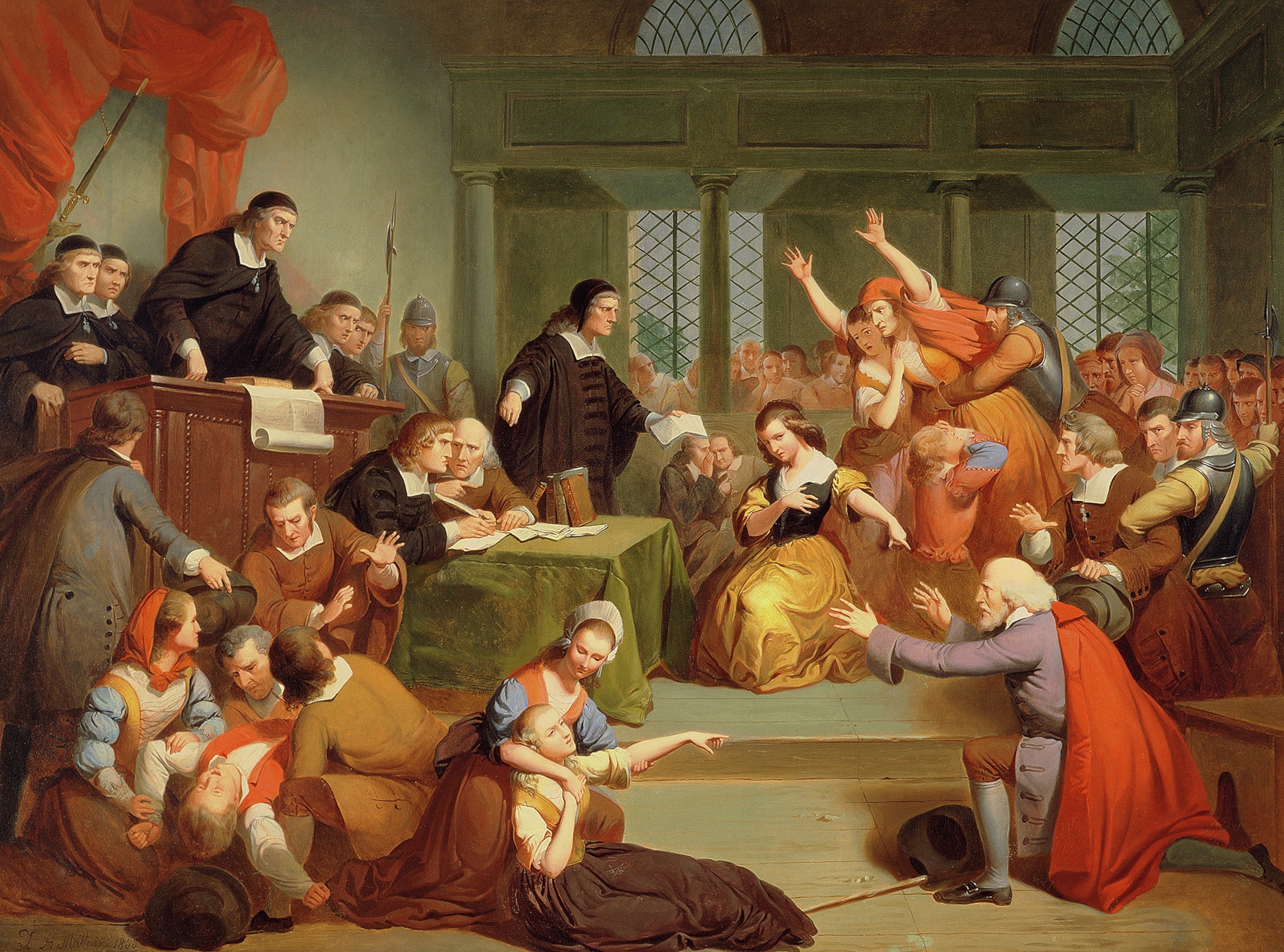 A man is tried for witchcraft in a courtroom.