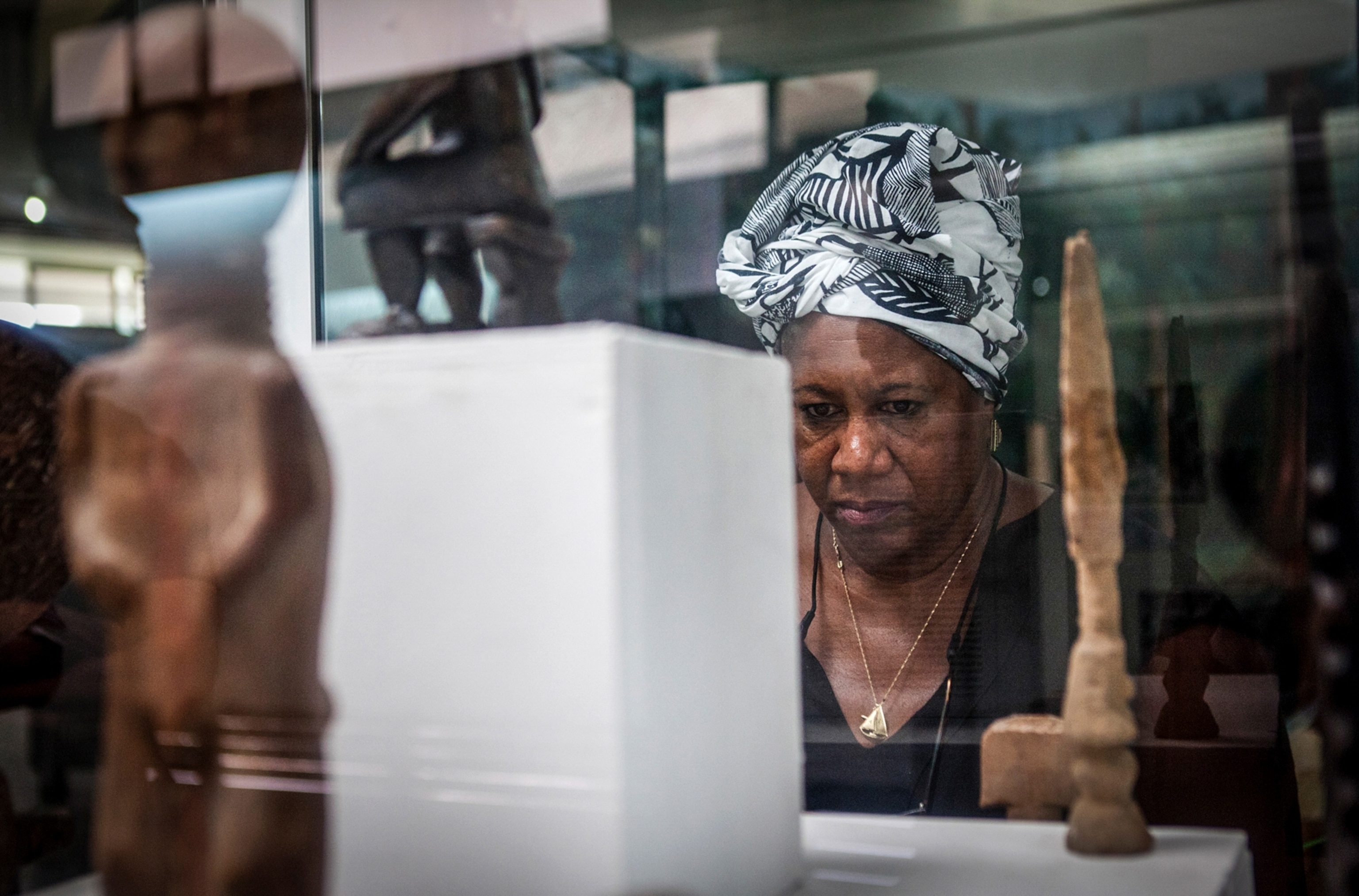 a tourist looking at a display at the National Museum in Accra, Ghana