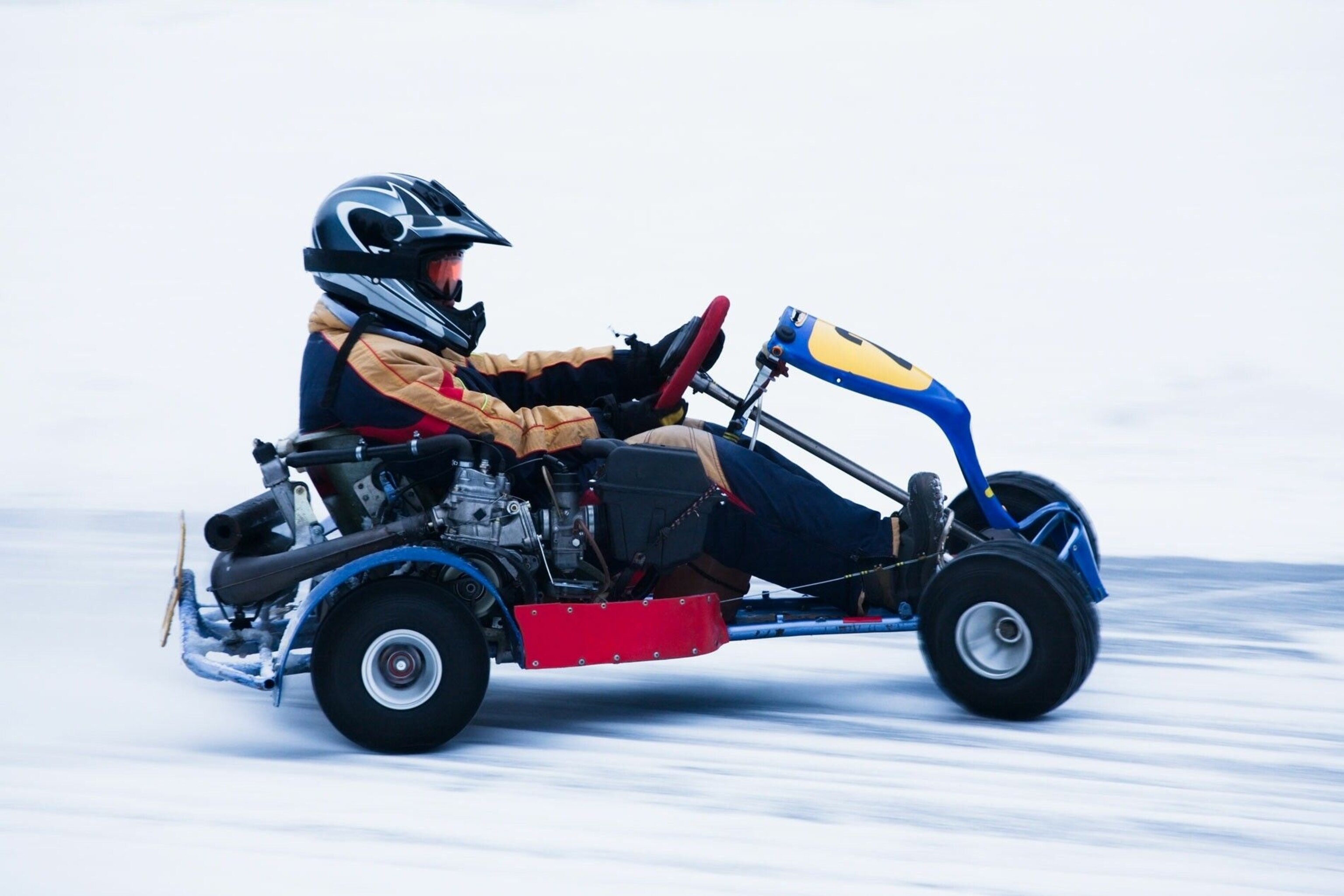 A person drives an ice-kart.