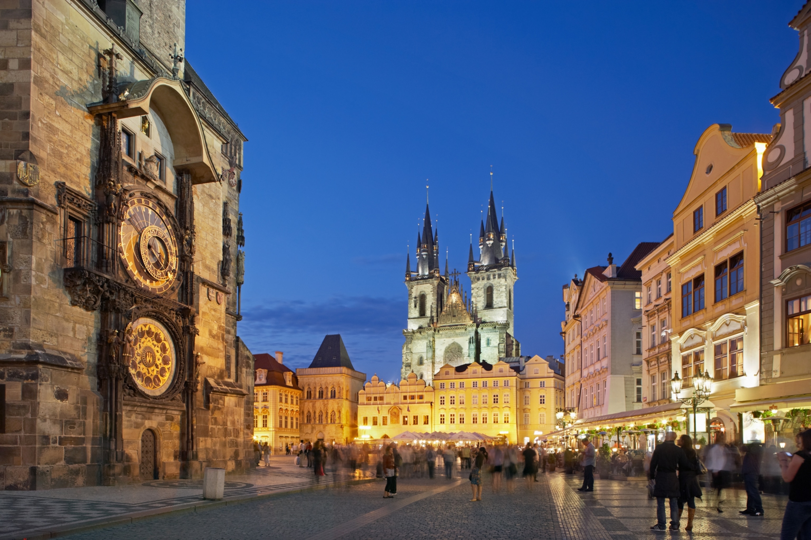 the Old Town Square and a dark blue sky at dusk in Prague