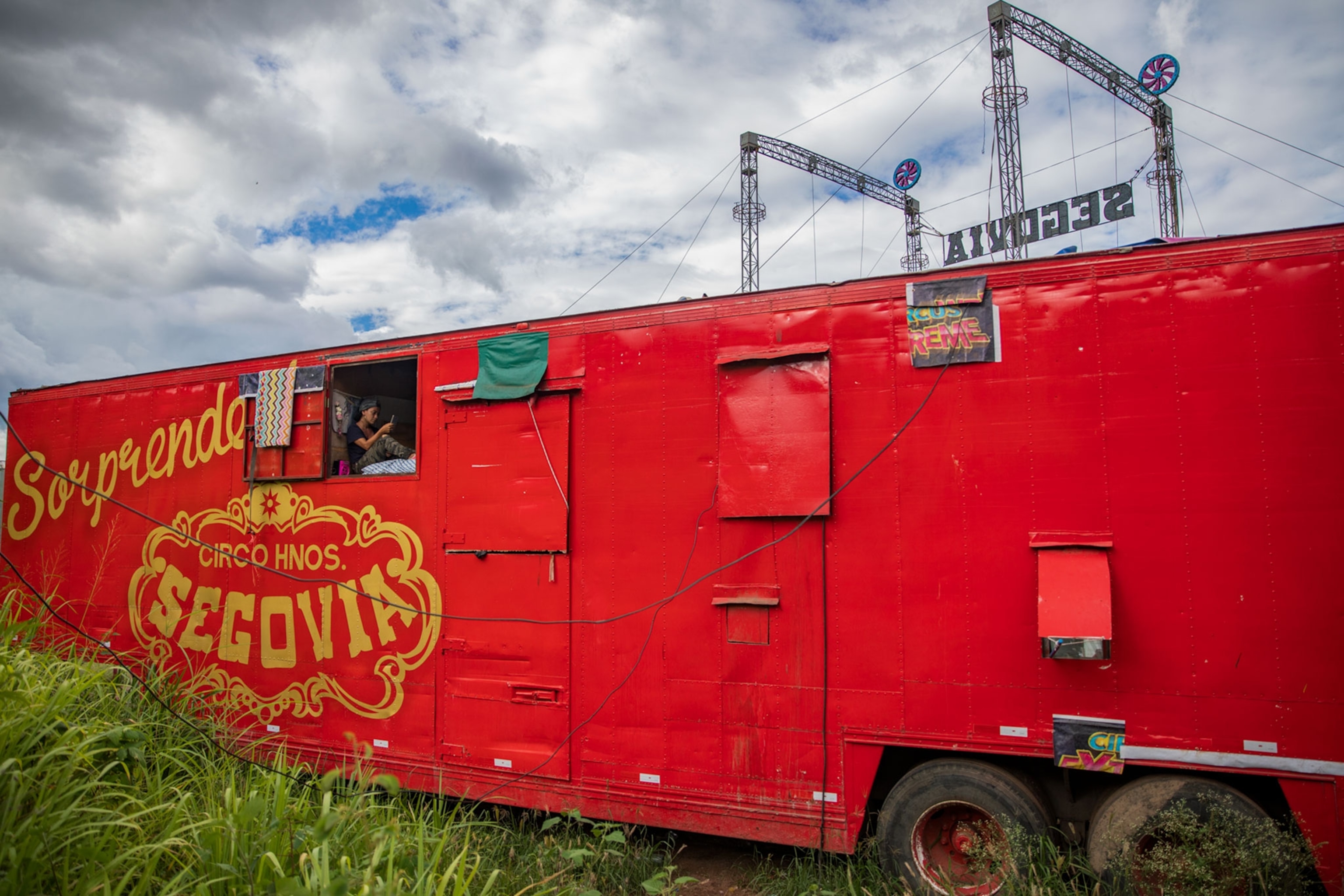 a circus performer sitting in their truck in Honduras