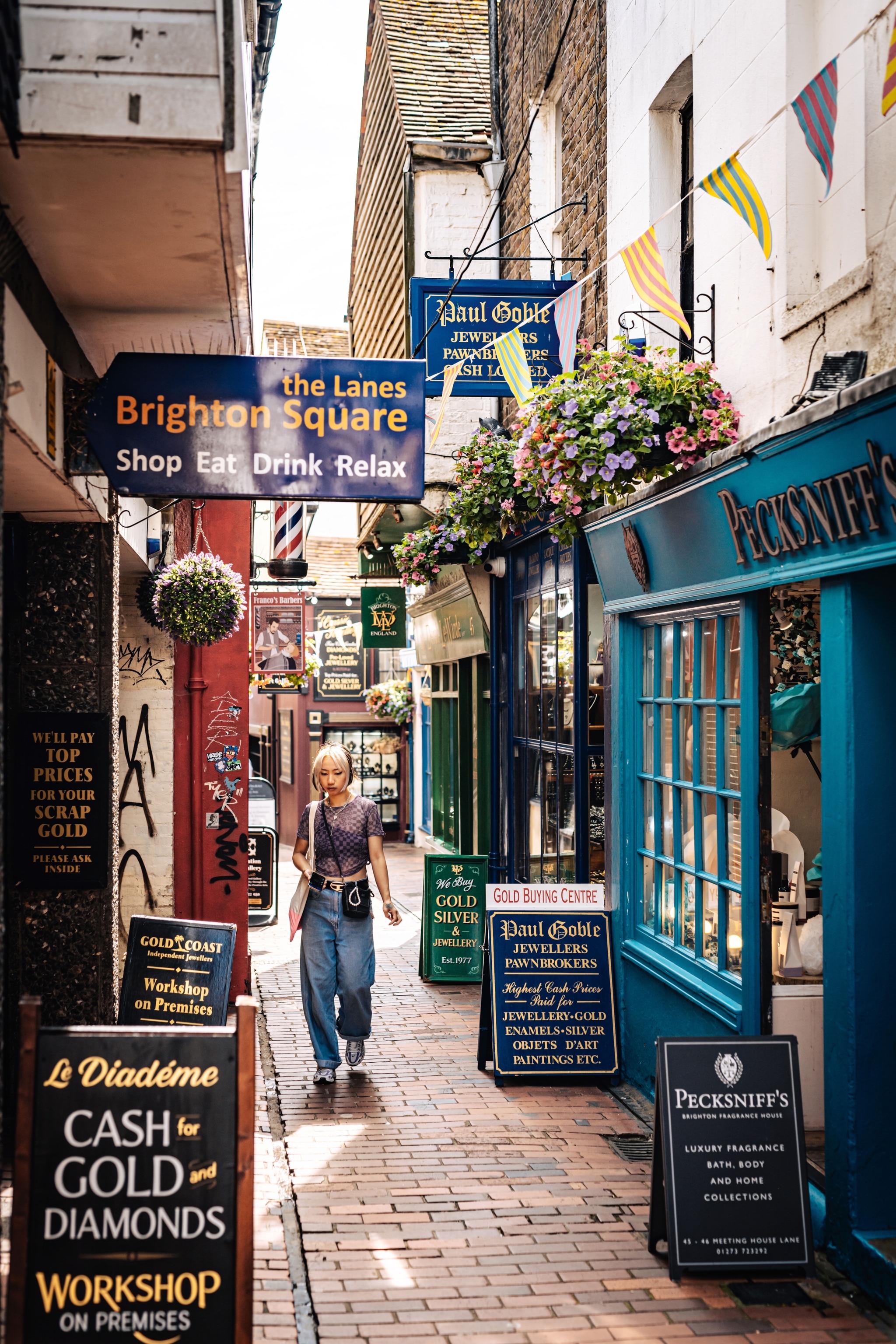 woman with headphones walking down walking lane
