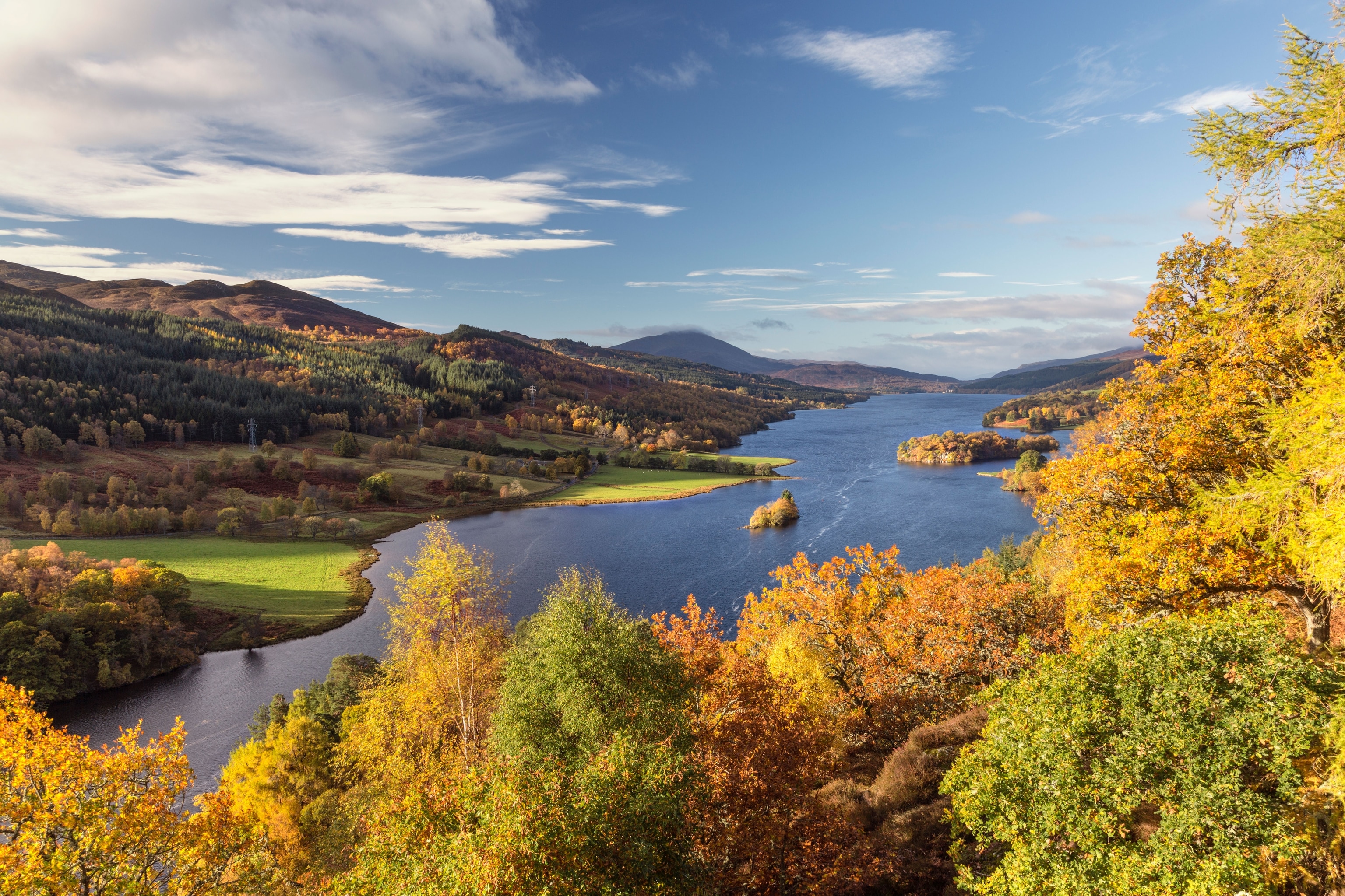 A glimpse of the loch and surrounding trees from view point in scotland