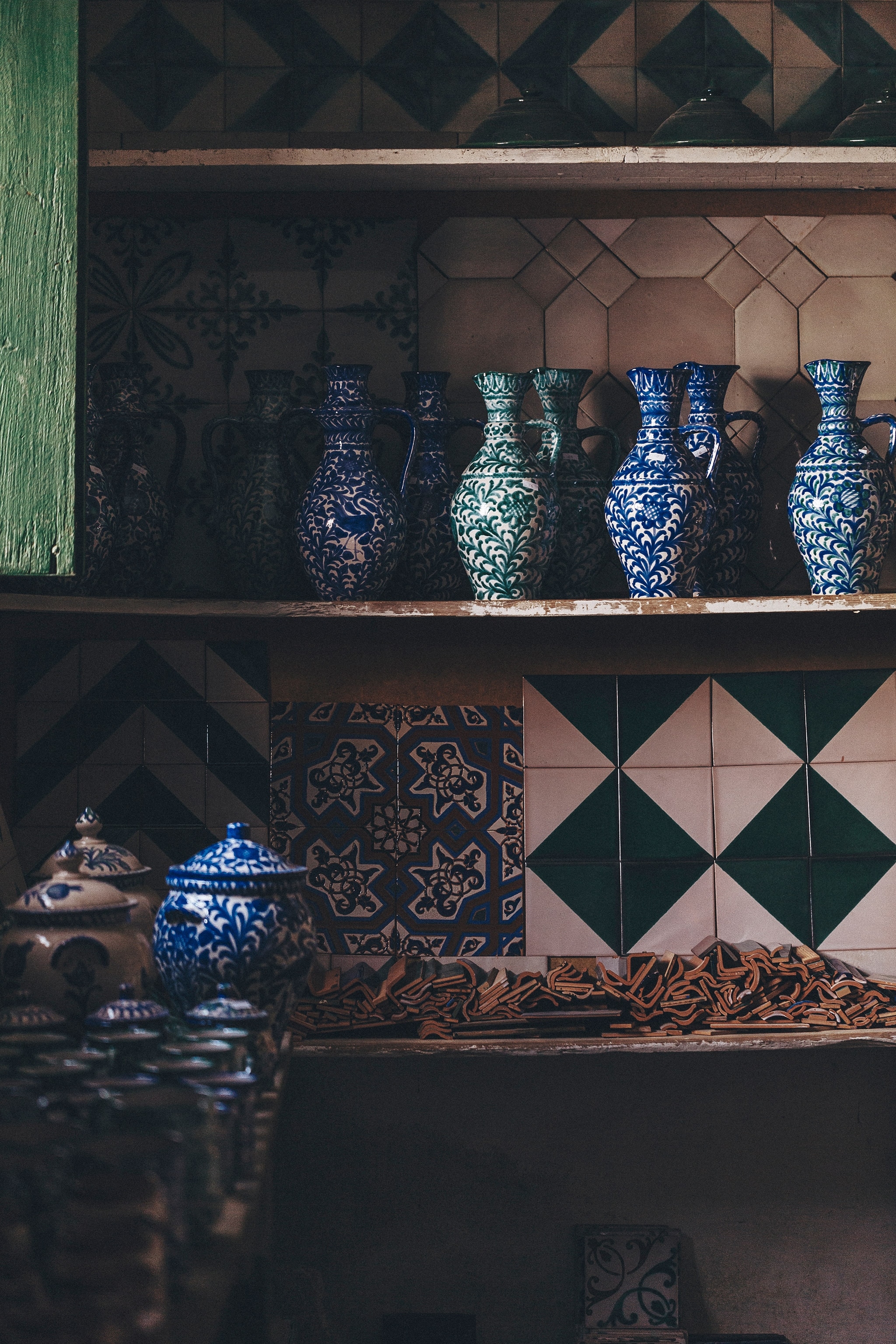 Decorative ceramic vases and bowls on the shelves of a storeroom at Ceramica Fajalauza