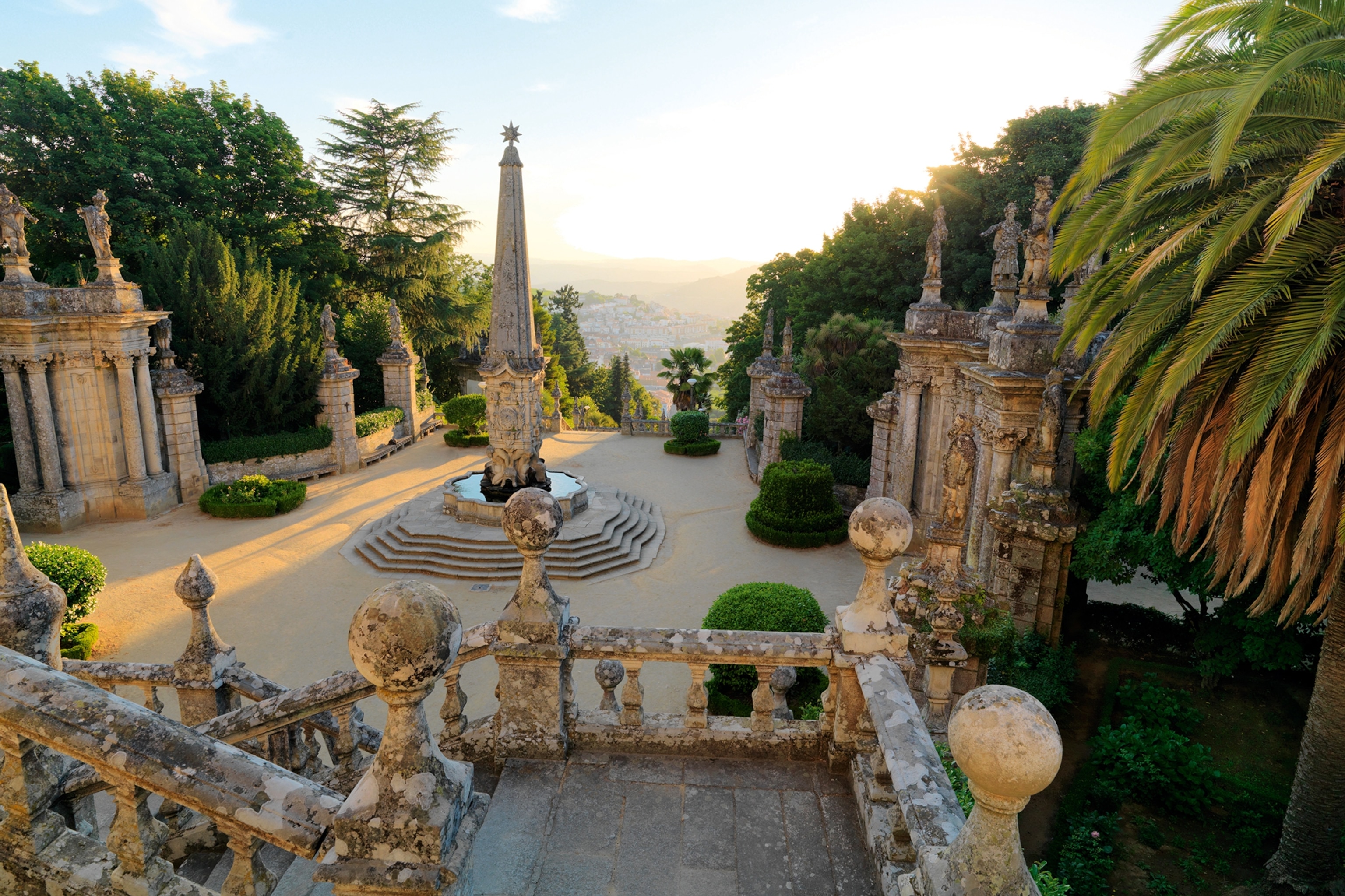 A historic viewpoint over Douro Valley, build from stone with a tall sculpture in the centre.