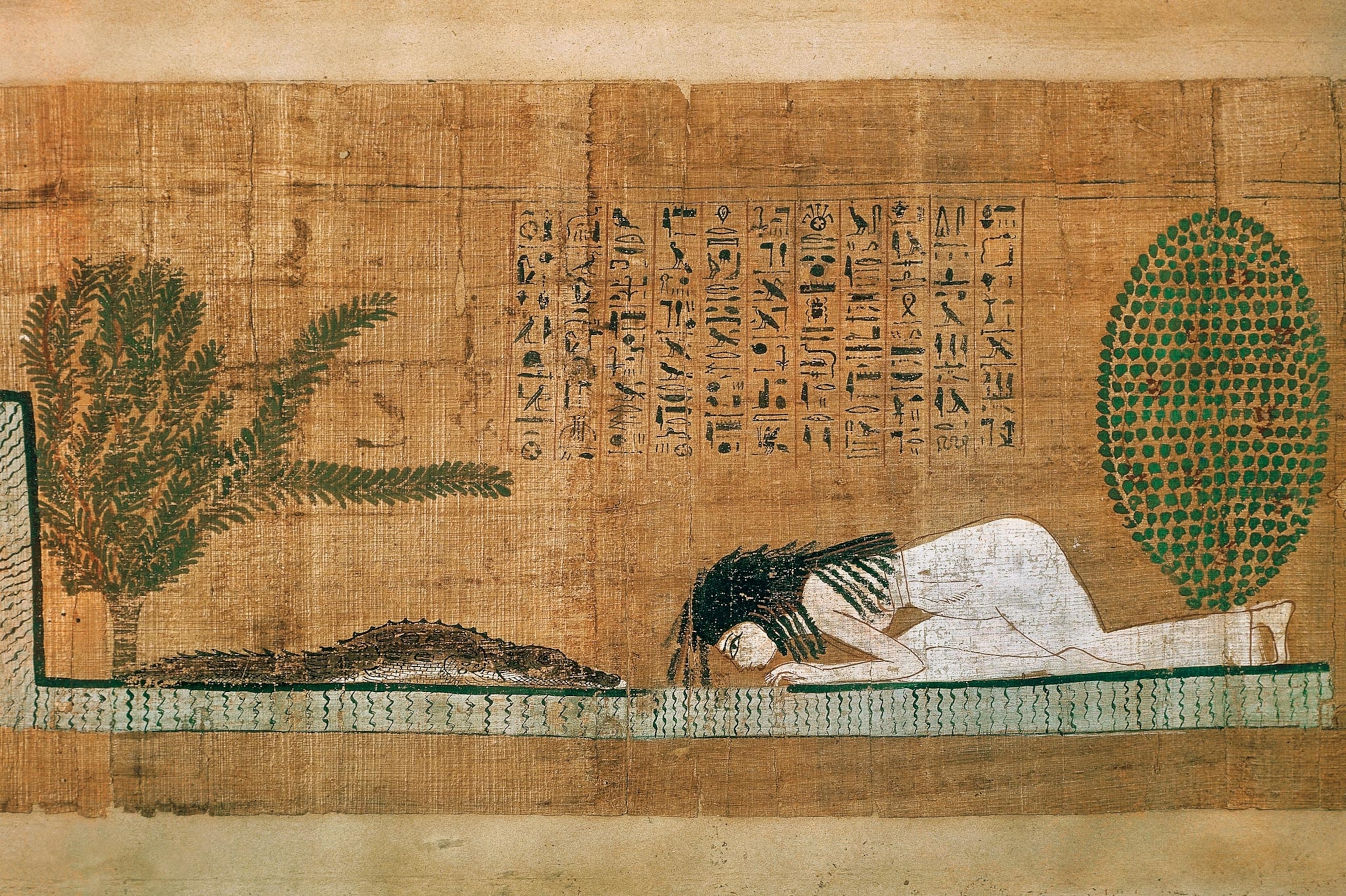 Photo of art on papyrus with person kneeling before crocodile